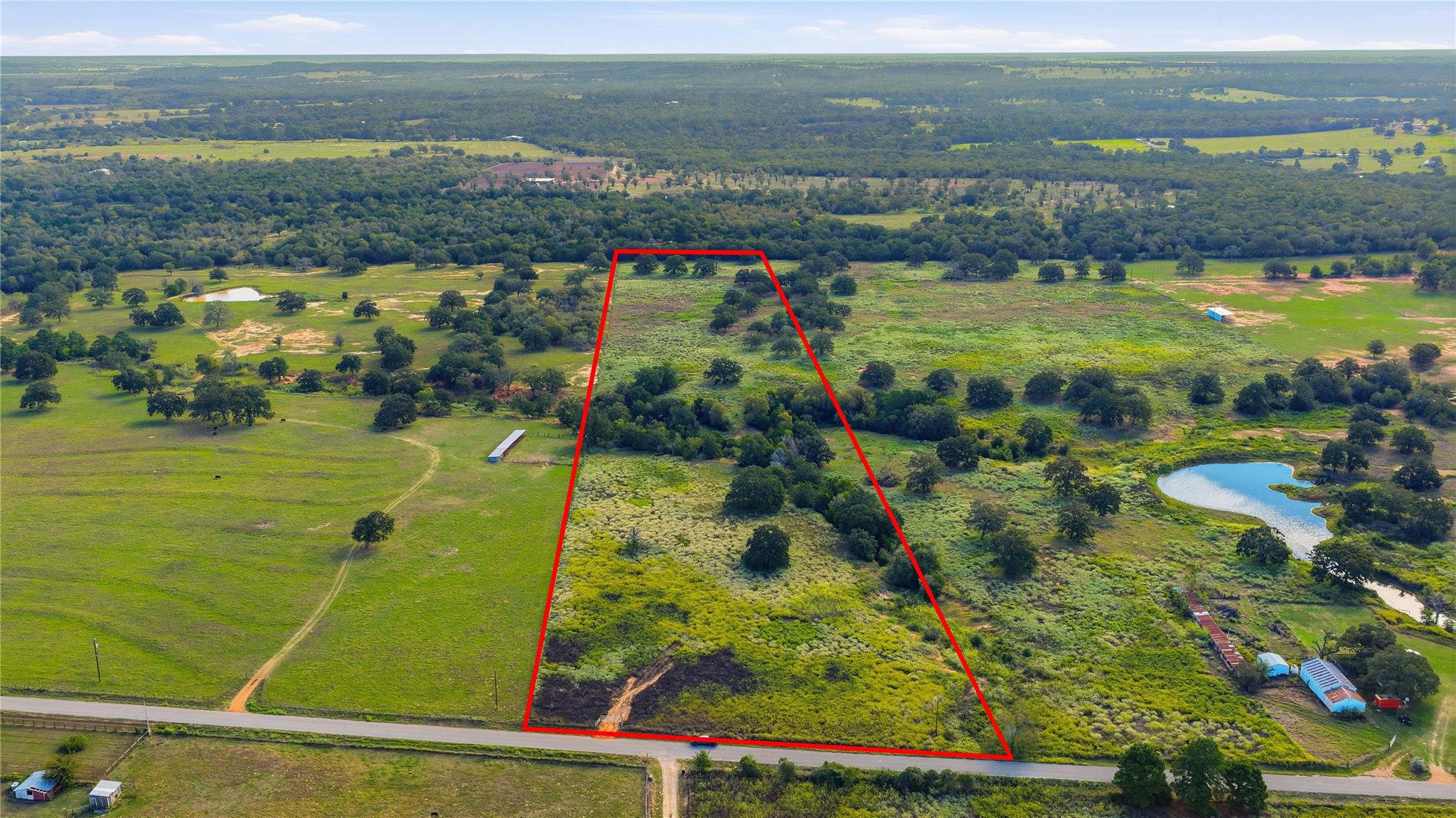 A sweeping aerial view showcases the vast acreage
