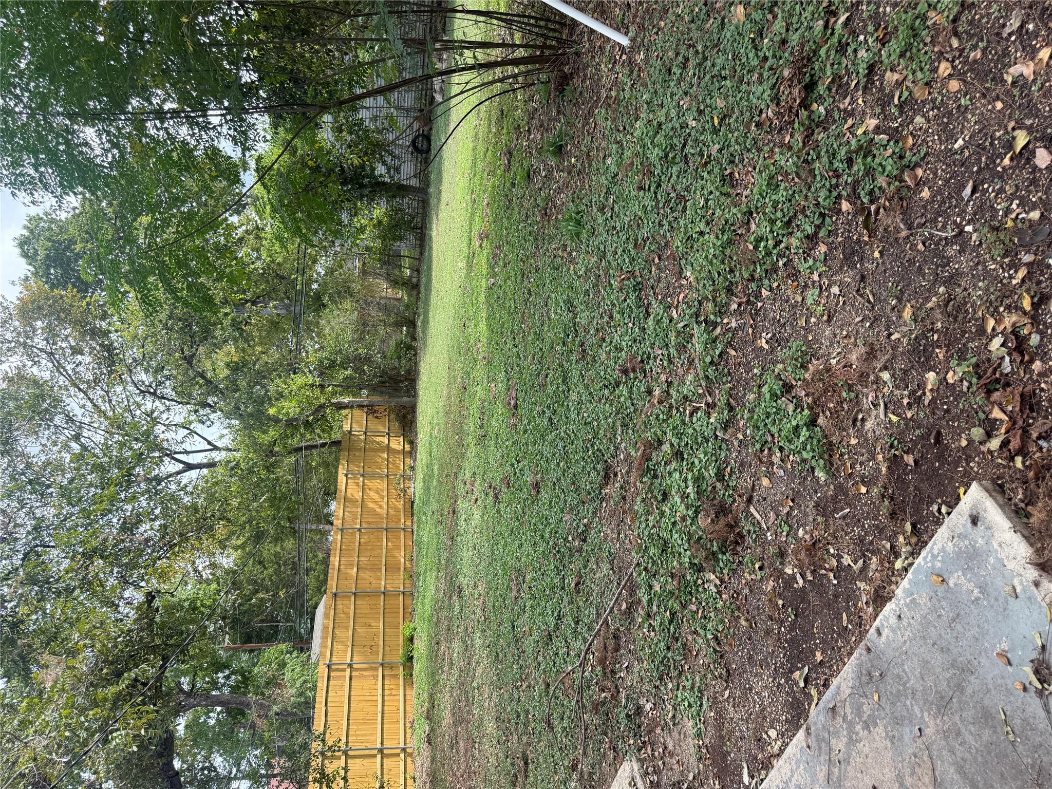Mature trees shade a spacious and fully fenced ba