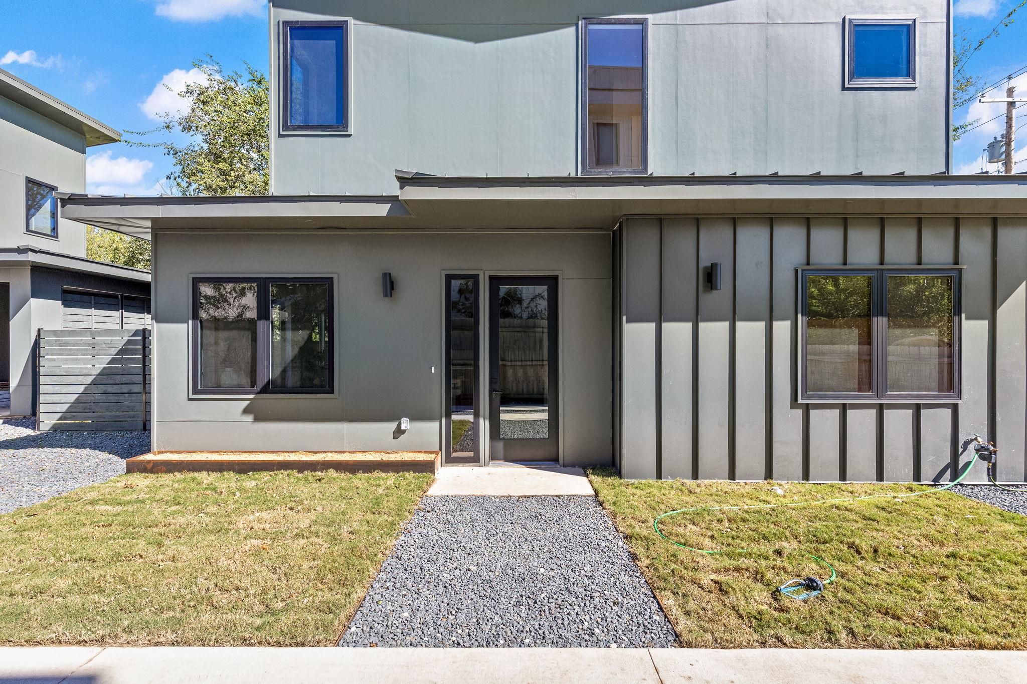Clean lines and vertical siding define the contem