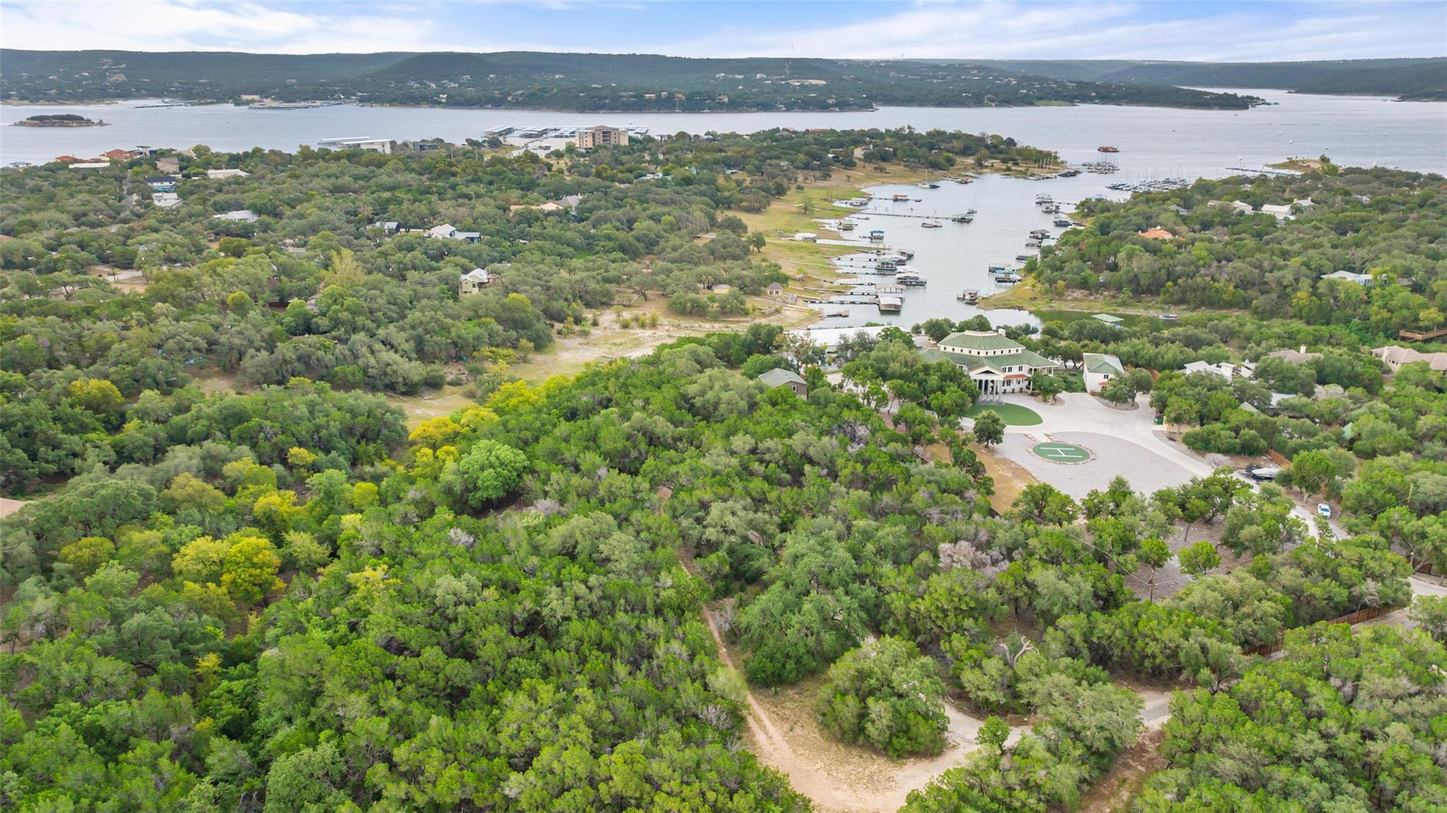 Lush wooded acreage sits adjacent to a scenic mar