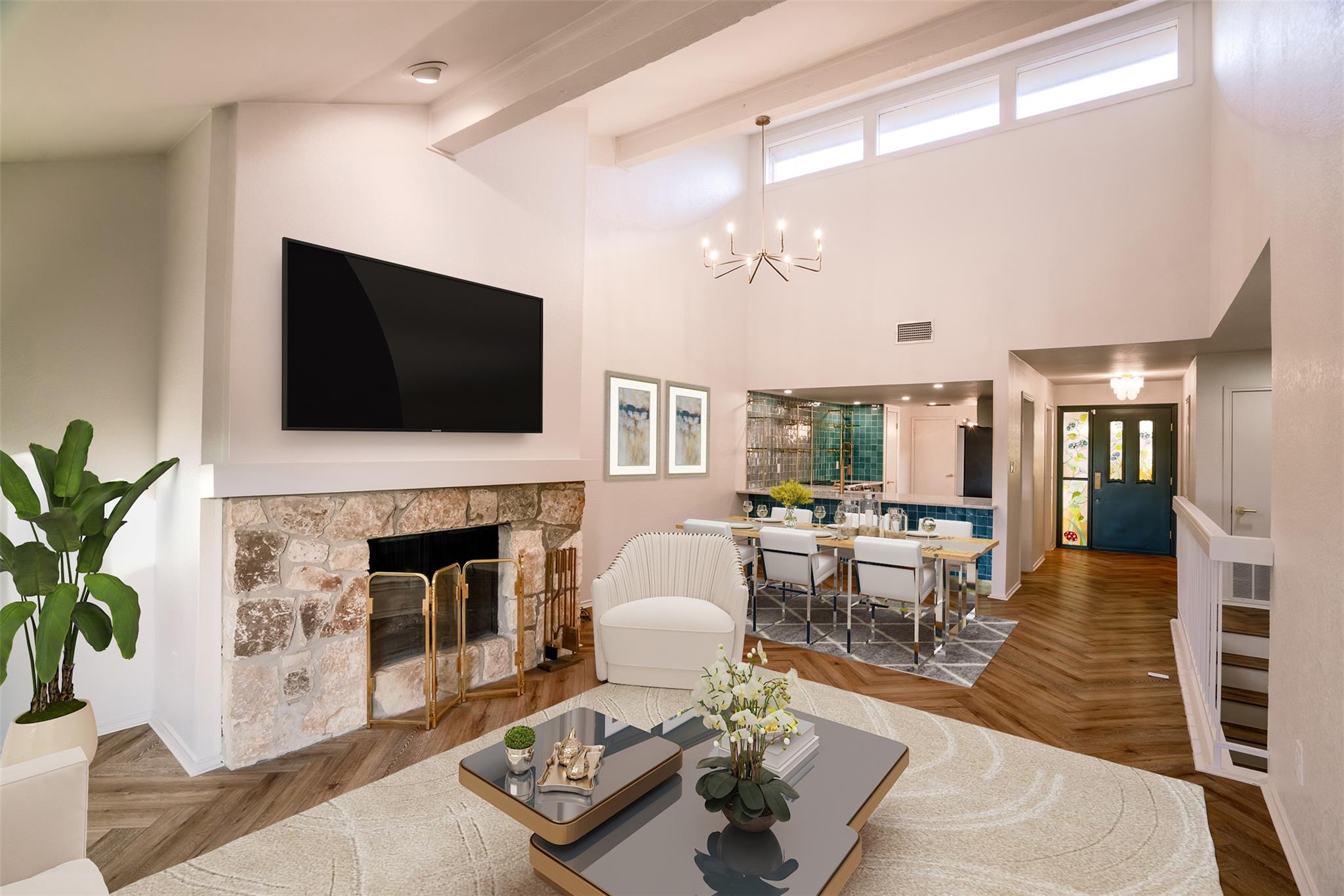 Dramatic vaulted ceilings and a stone fireplace a