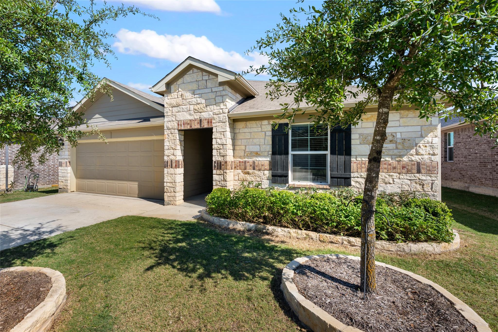 Textured stone veneer accents the classic front f