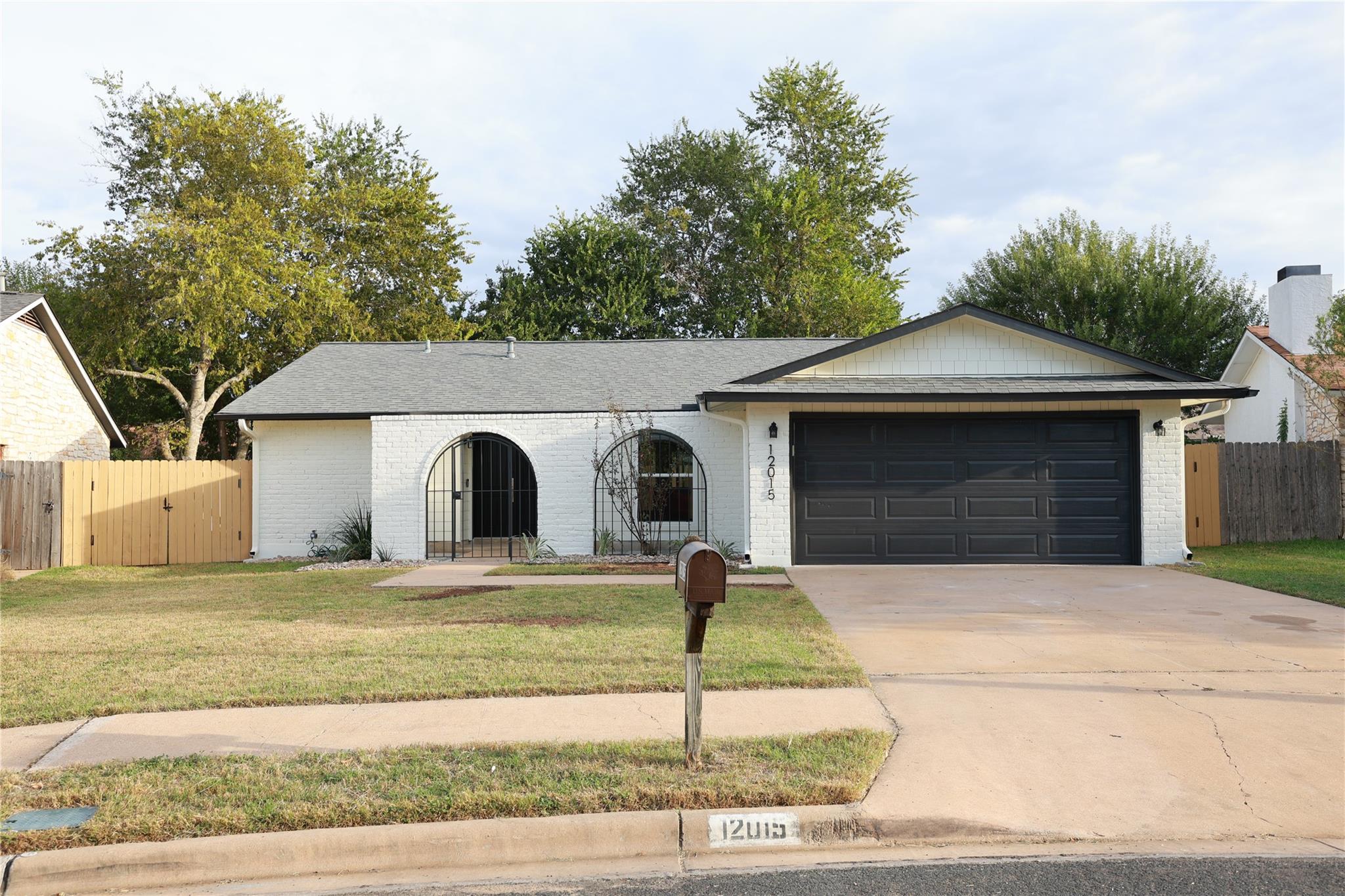 Arched entry details pair elegantly with a sleek 