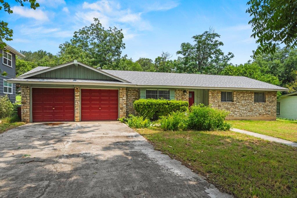 A classic ranch exterior showcases textured stone