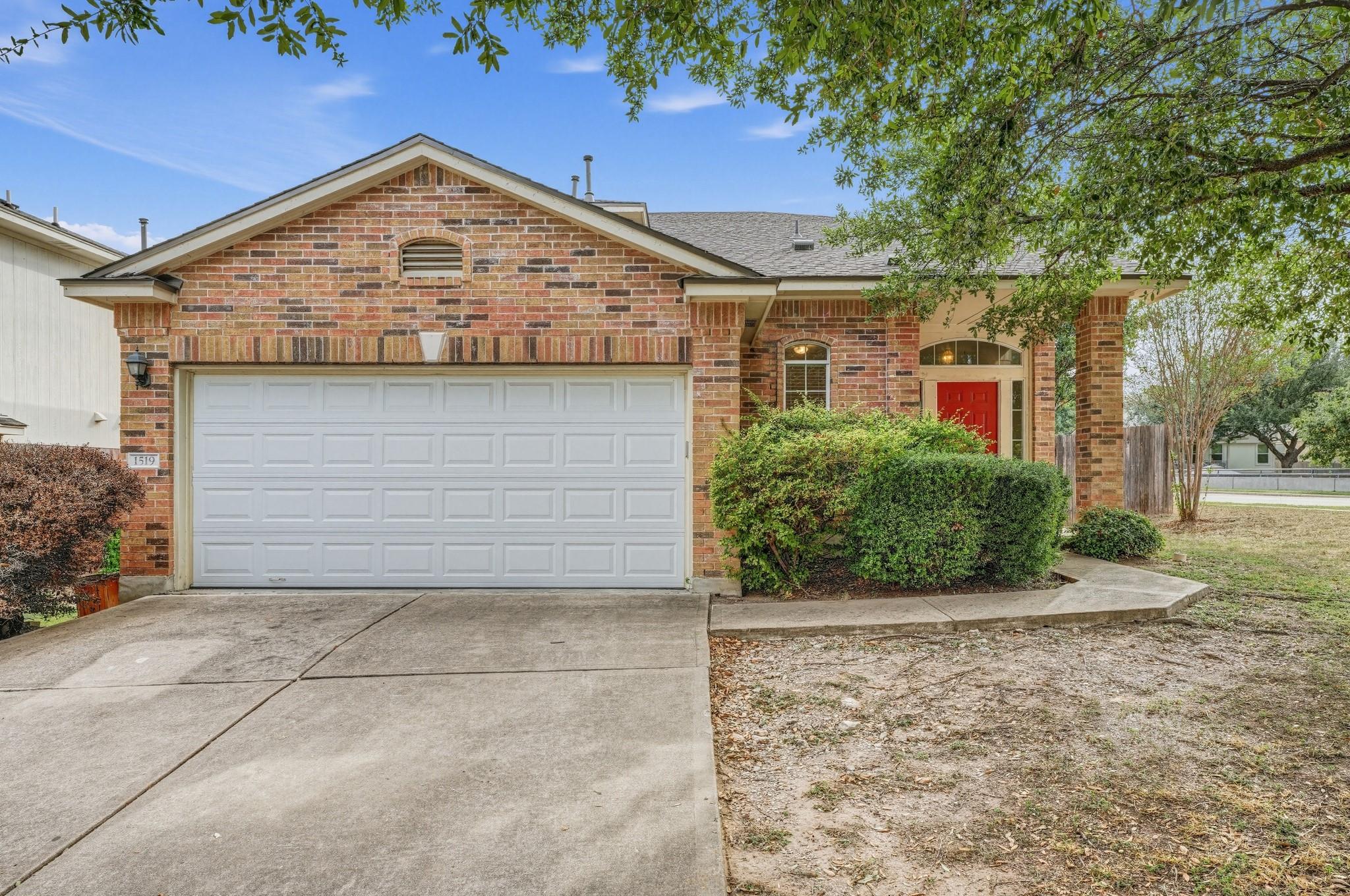 Classic brick exterior and an attached garage est