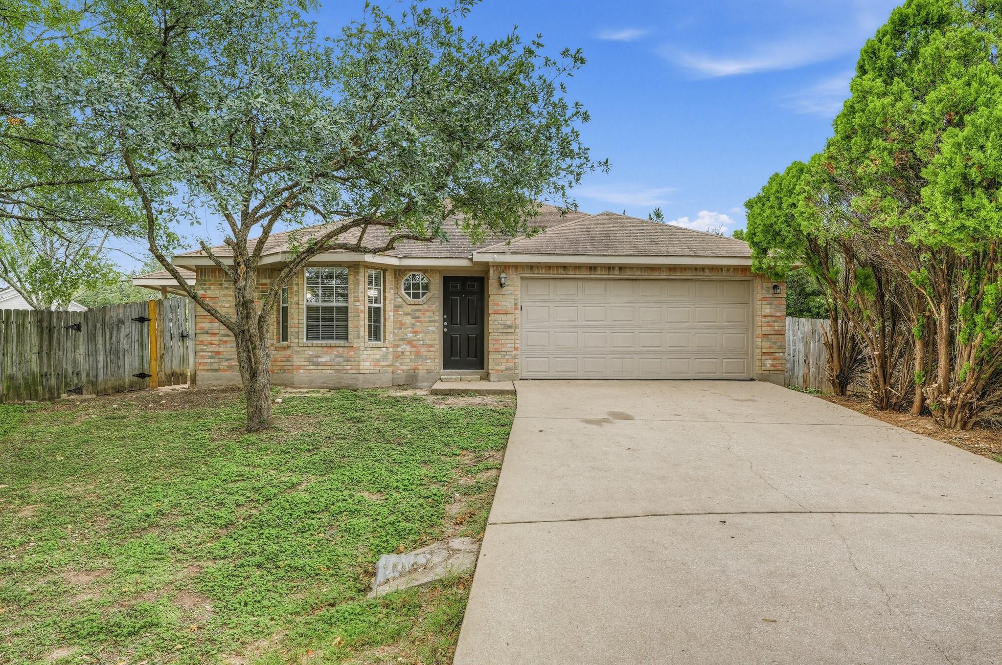Classic brick exterior showcases a two-car garage