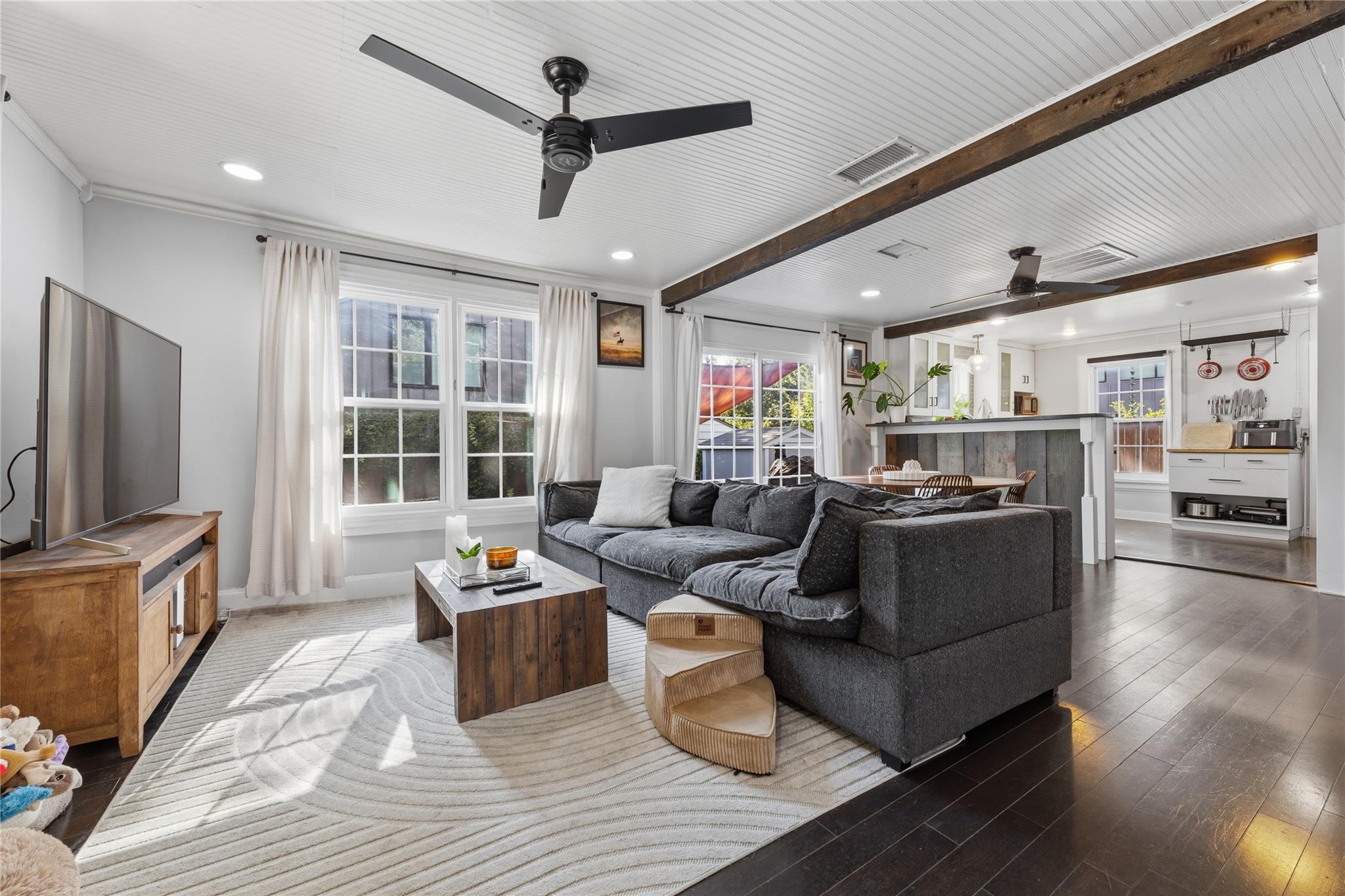 Rich hardwood floors anchor this inviting, open-c