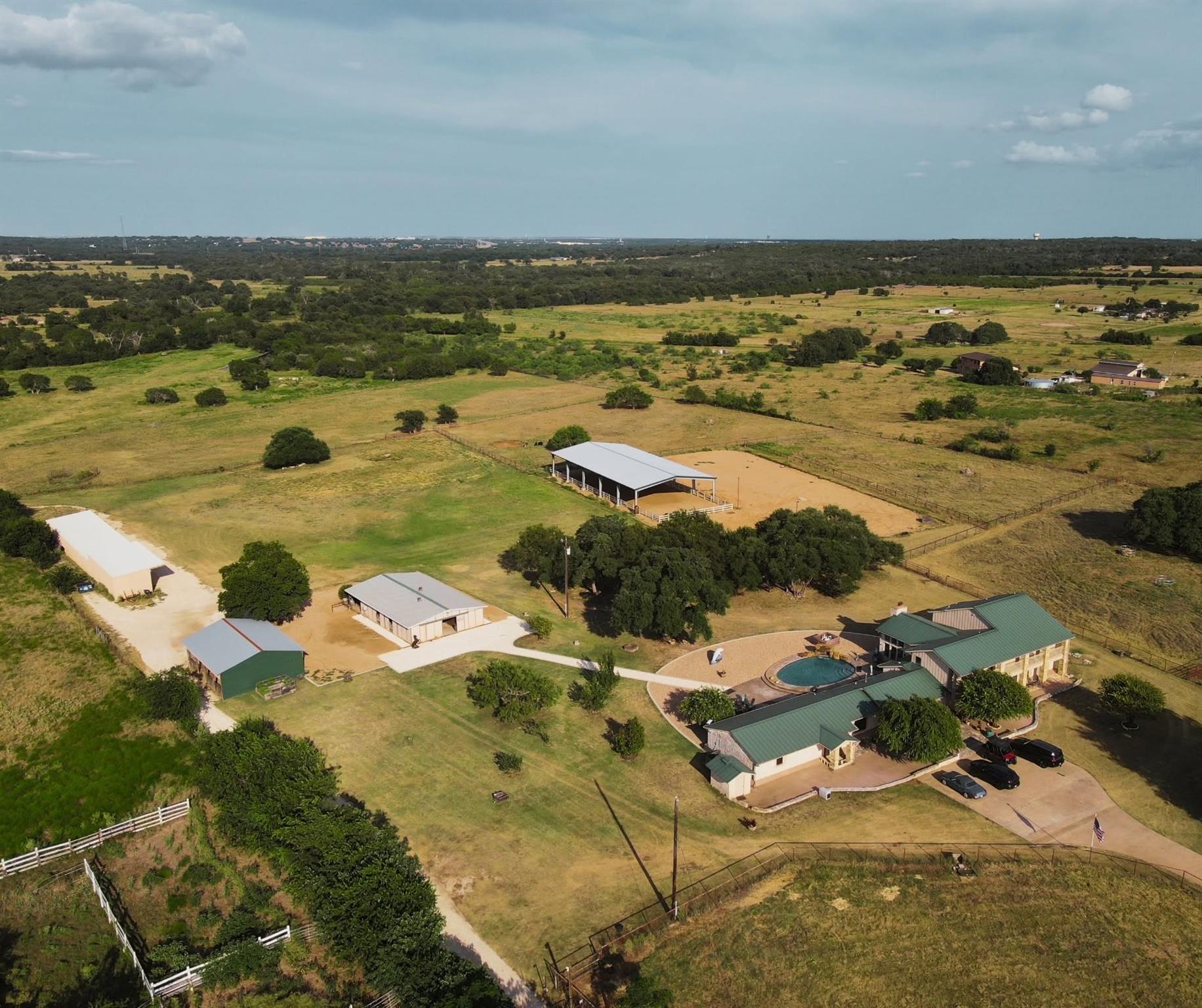 An expansive rural property features multiple out