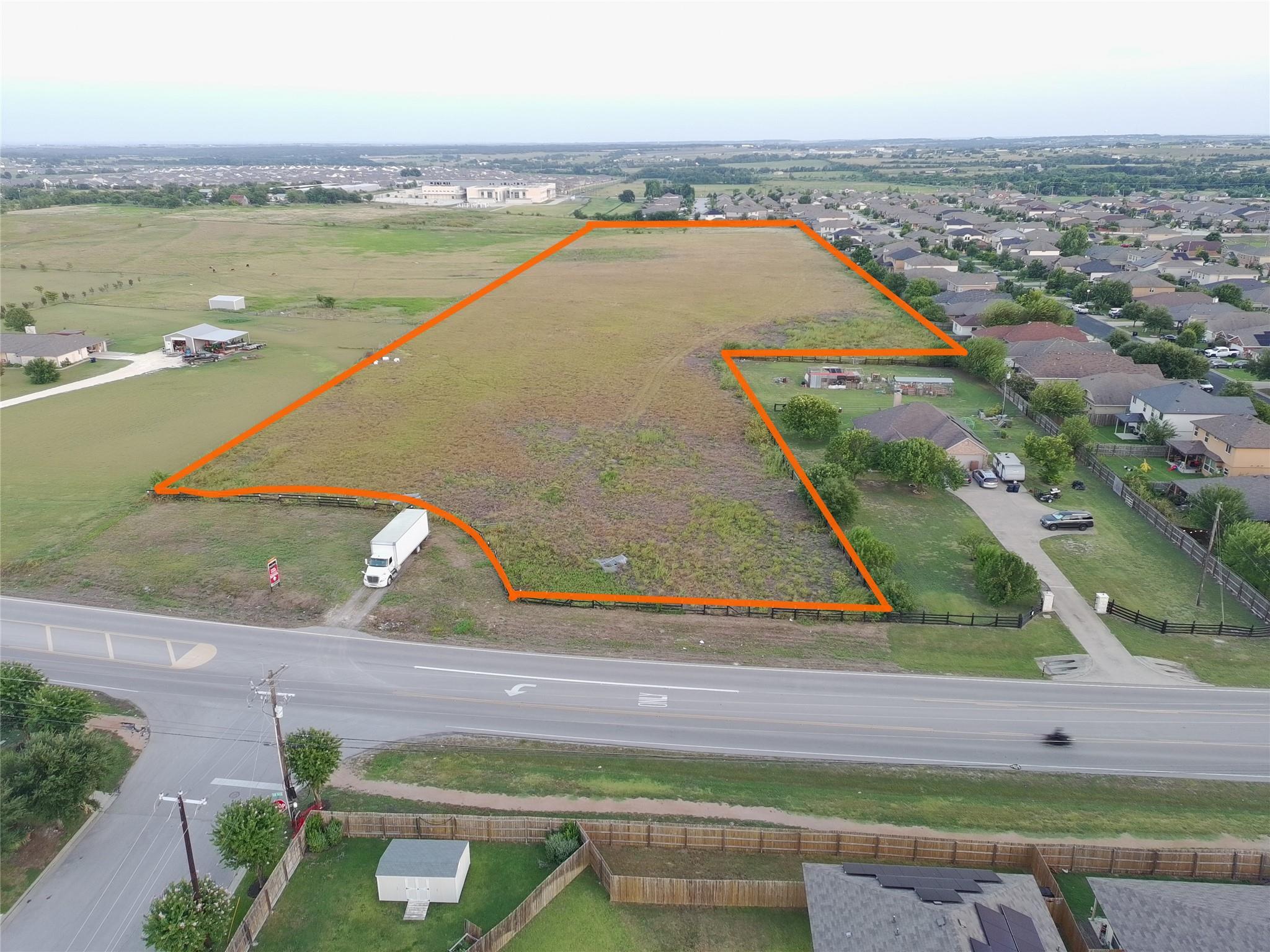 An expansive parcel of level land sits adjacent t
