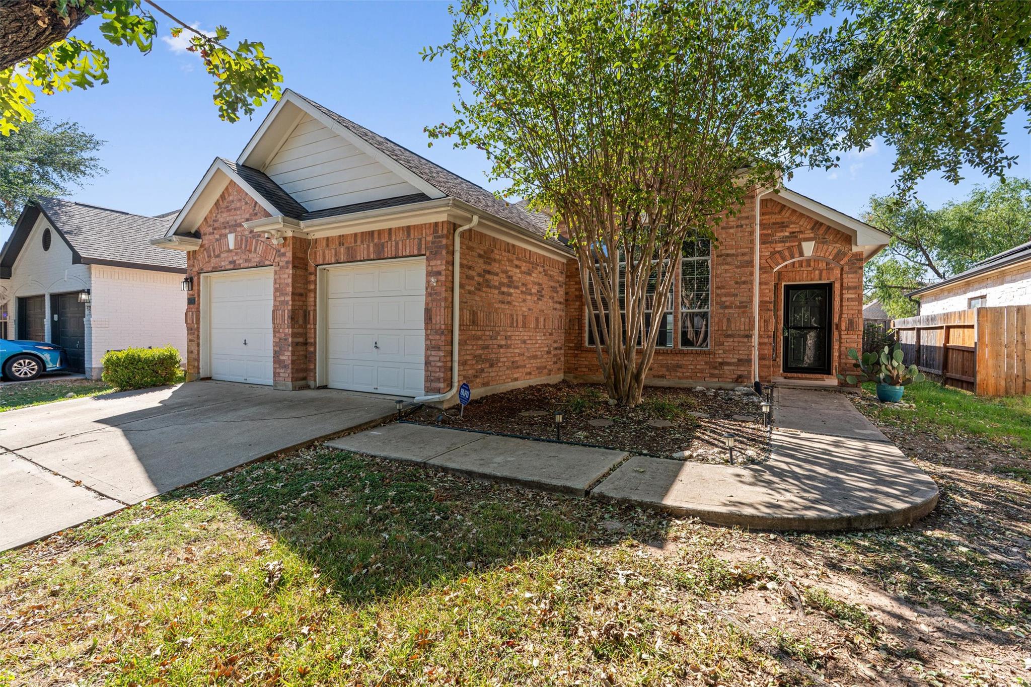 Classic brick exterior features a front-facing tw