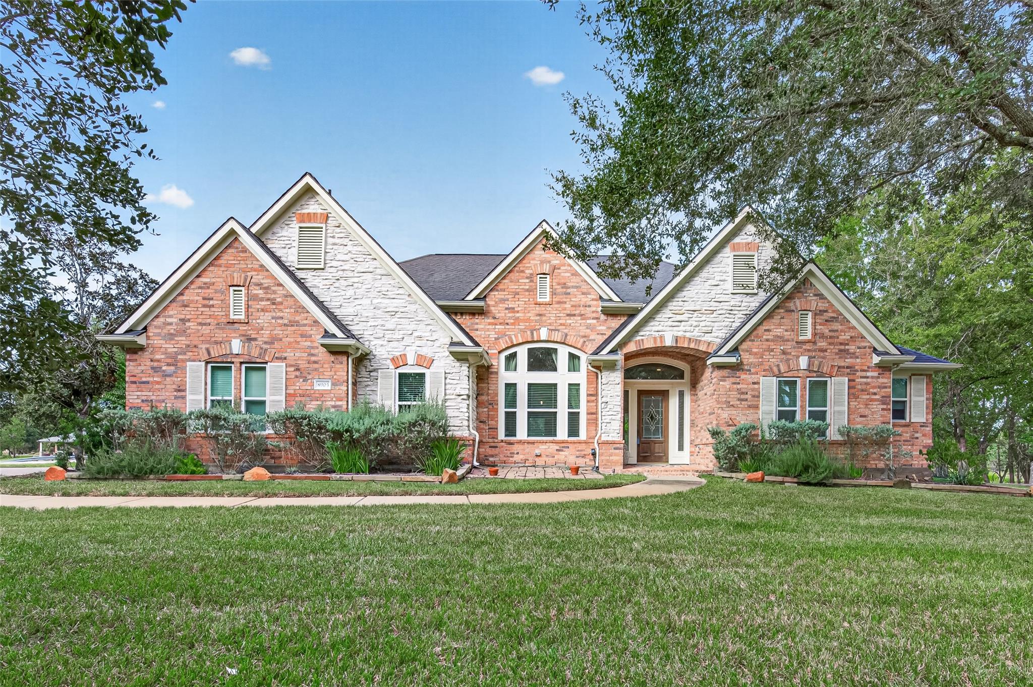 Multi-textured brick and stone cladding defines t