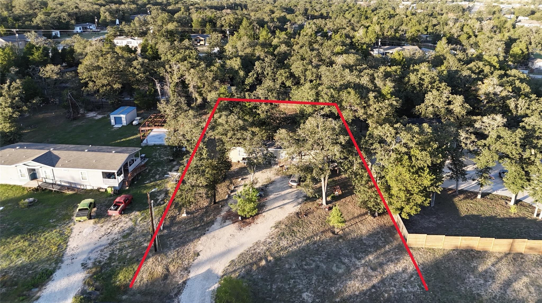 Mature trees surround this private lot outlined b
