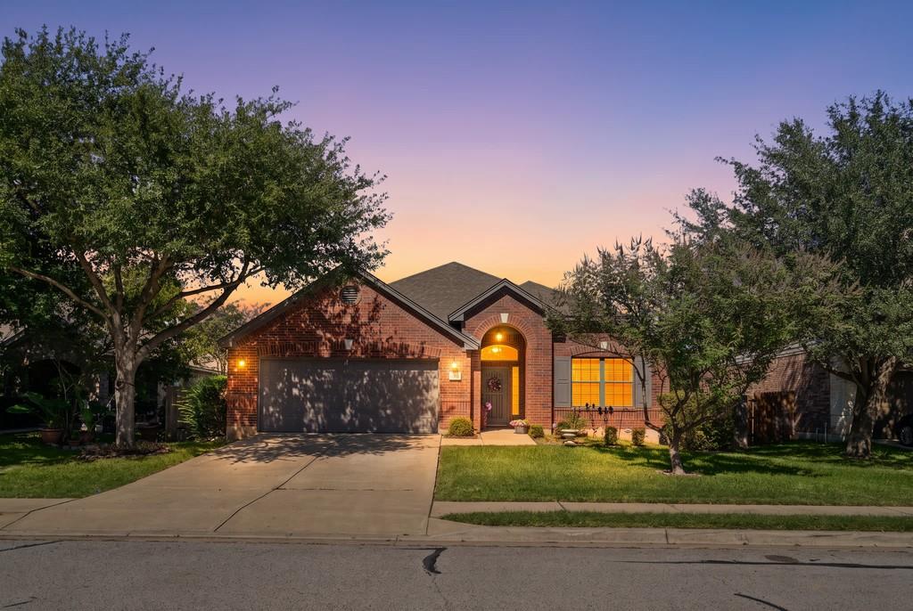 An arched entry and classic brick facade create t