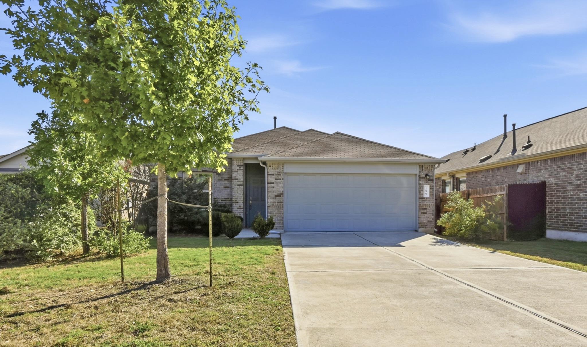 Classic brick exterior highlights this single-fam