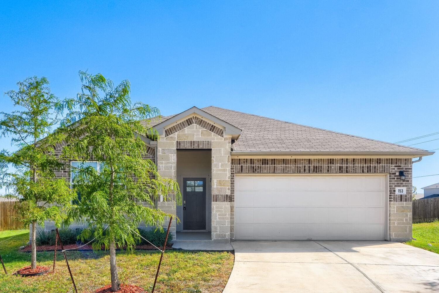 A classic brick exterior and private entry create