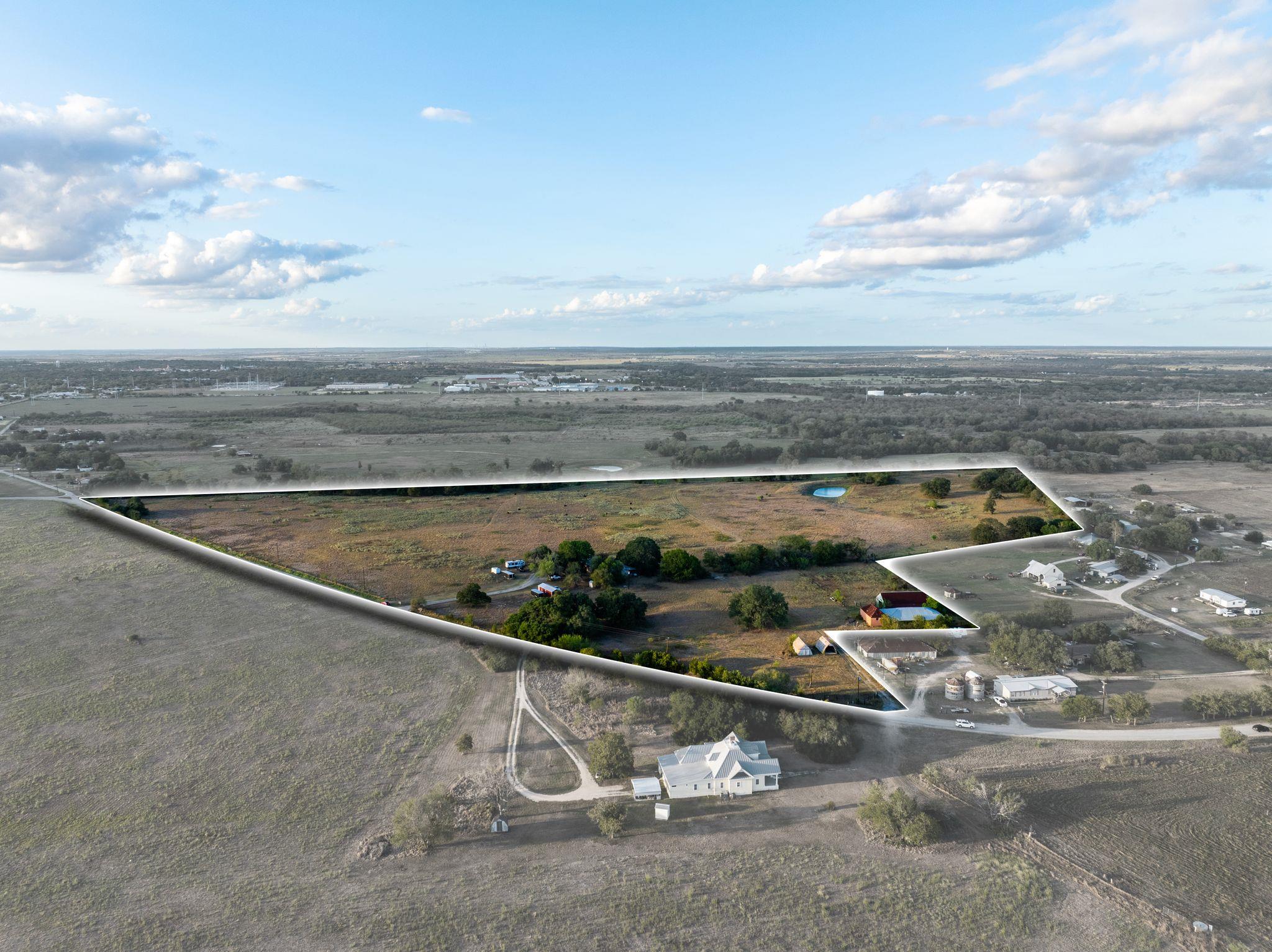 Acres of open pasture and mature trees offer a se