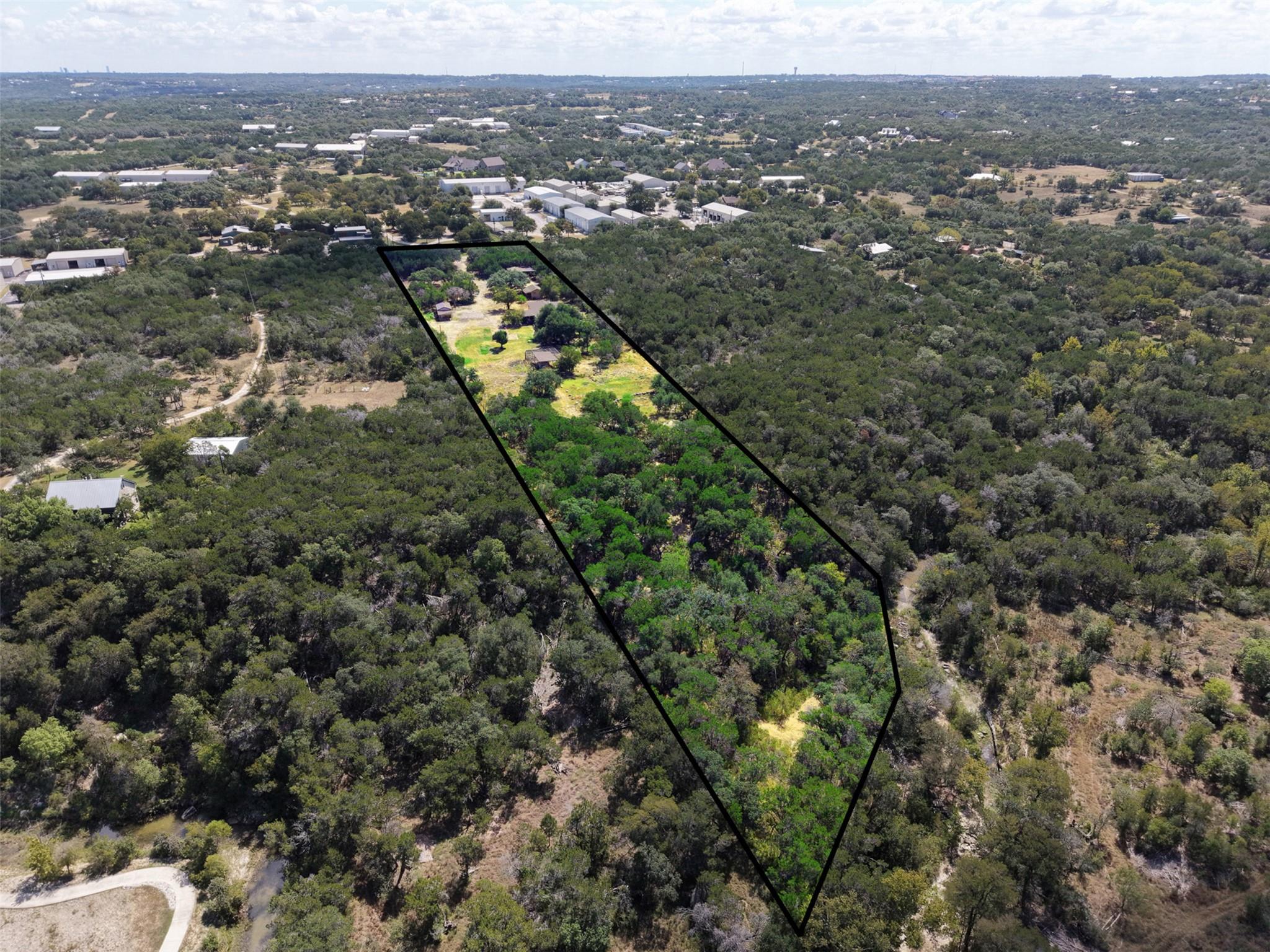 Mature woodlands blanket this expansive property 