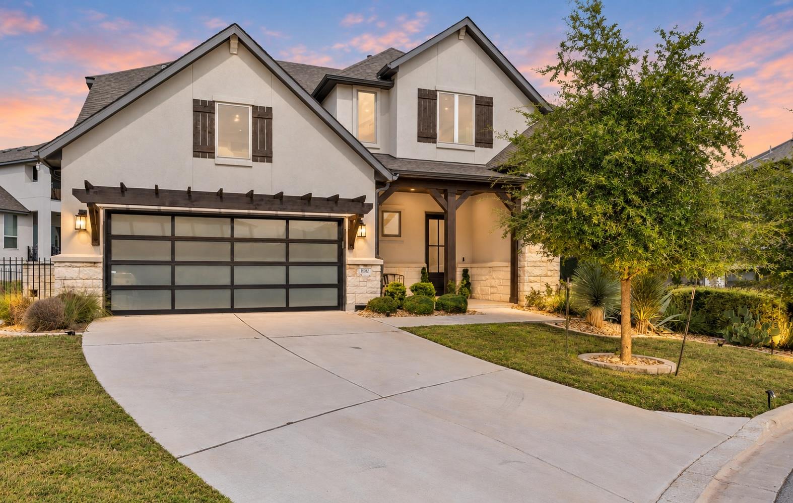 Elegant two-story stone and stucco exterior showc
