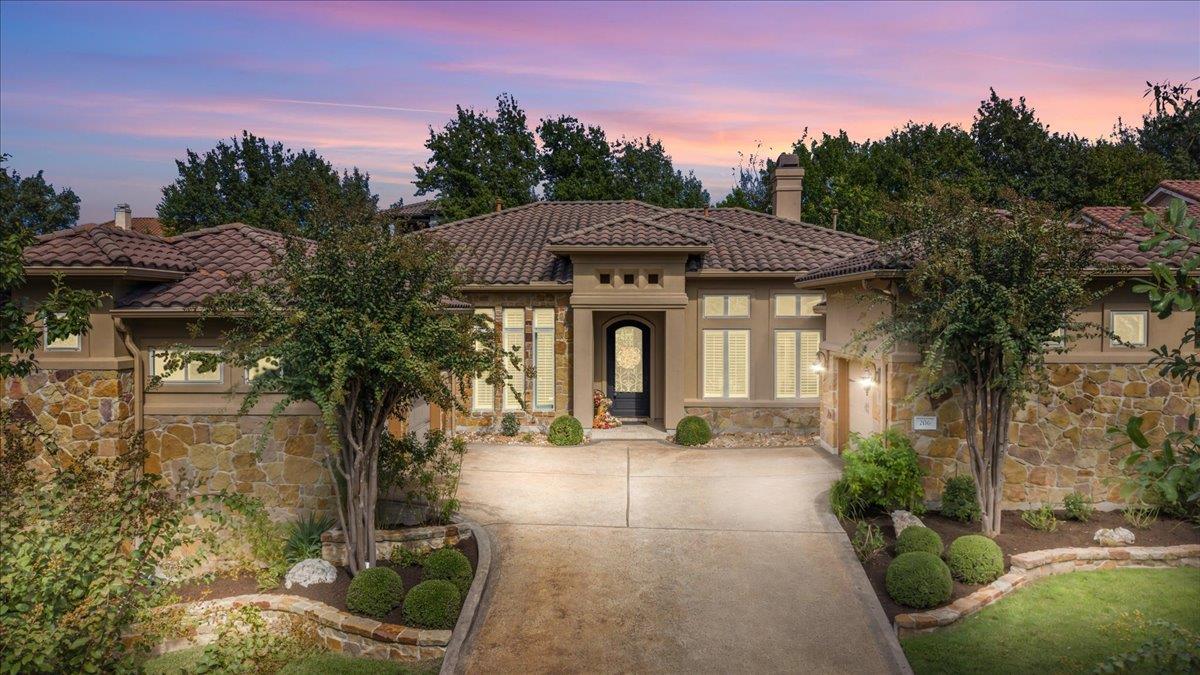 A grand stone facade paired with a tile roof crea
