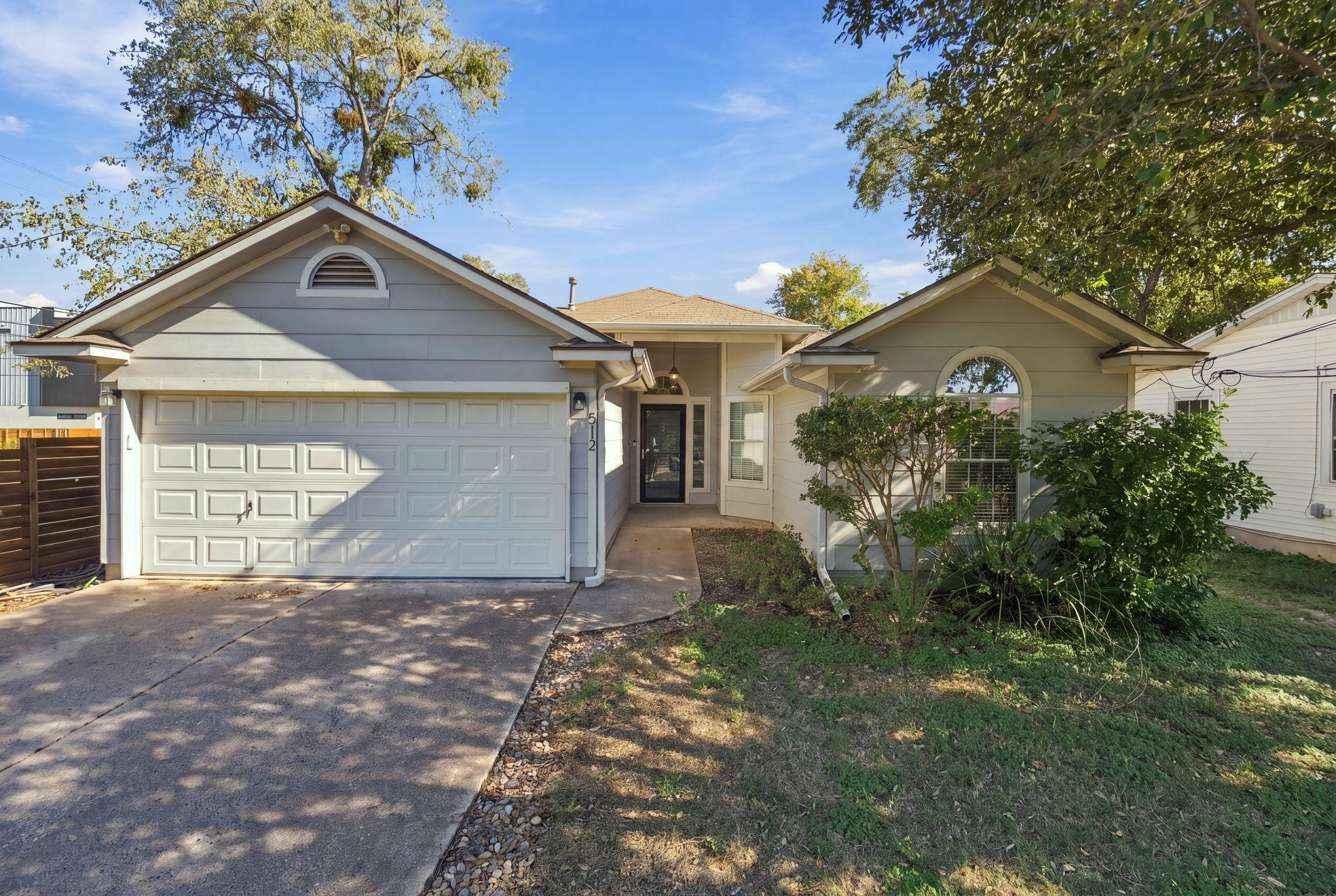 An inviting front facade features a classic gable