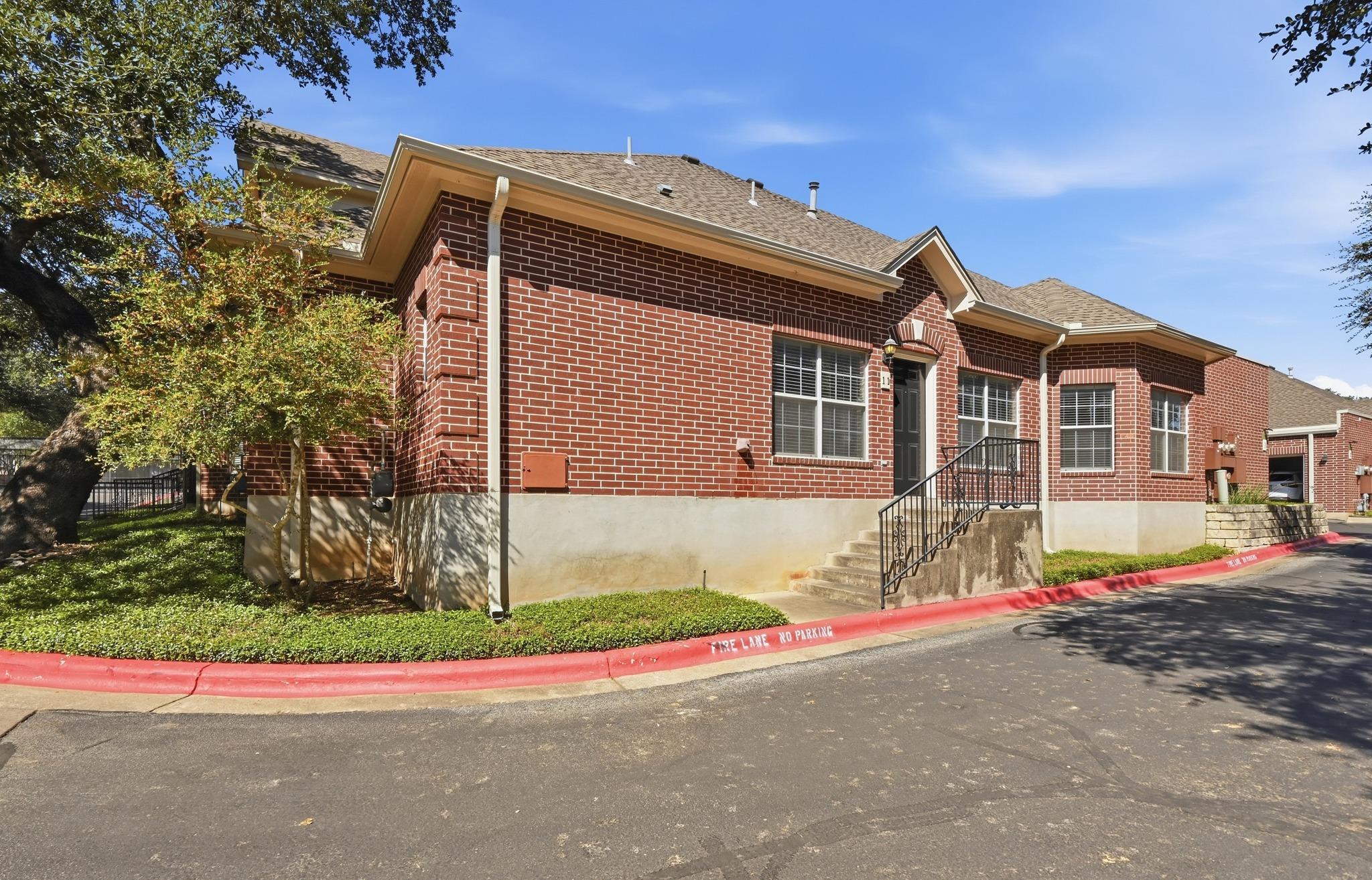 Classic brick exterior with a raised concrete fou