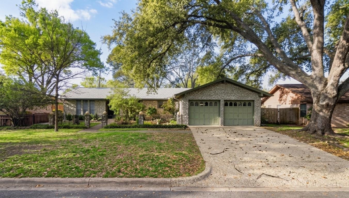 Mature trees shade a welcoming stone exterior fea