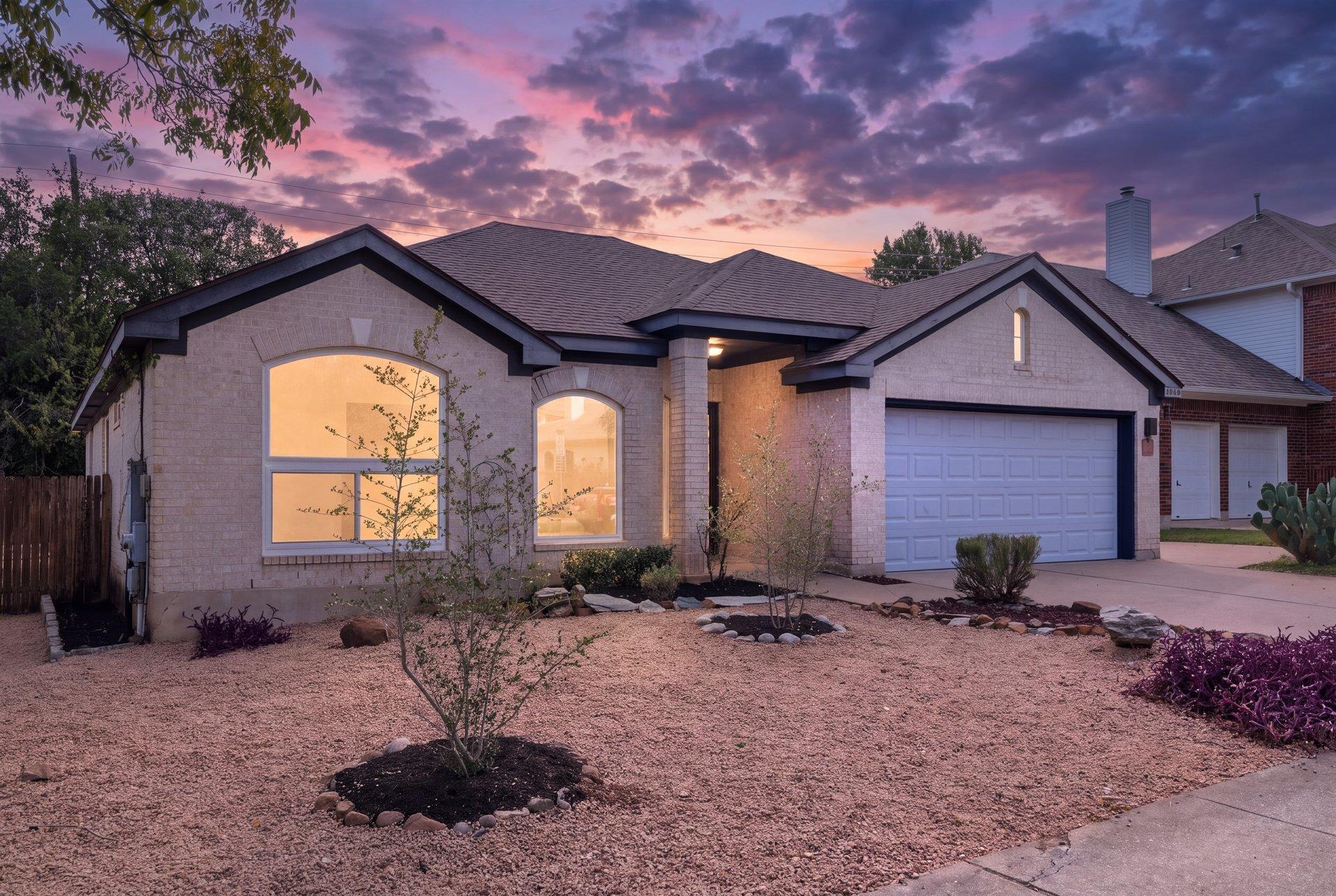 Elegant brick exterior with a low-maintenance lan