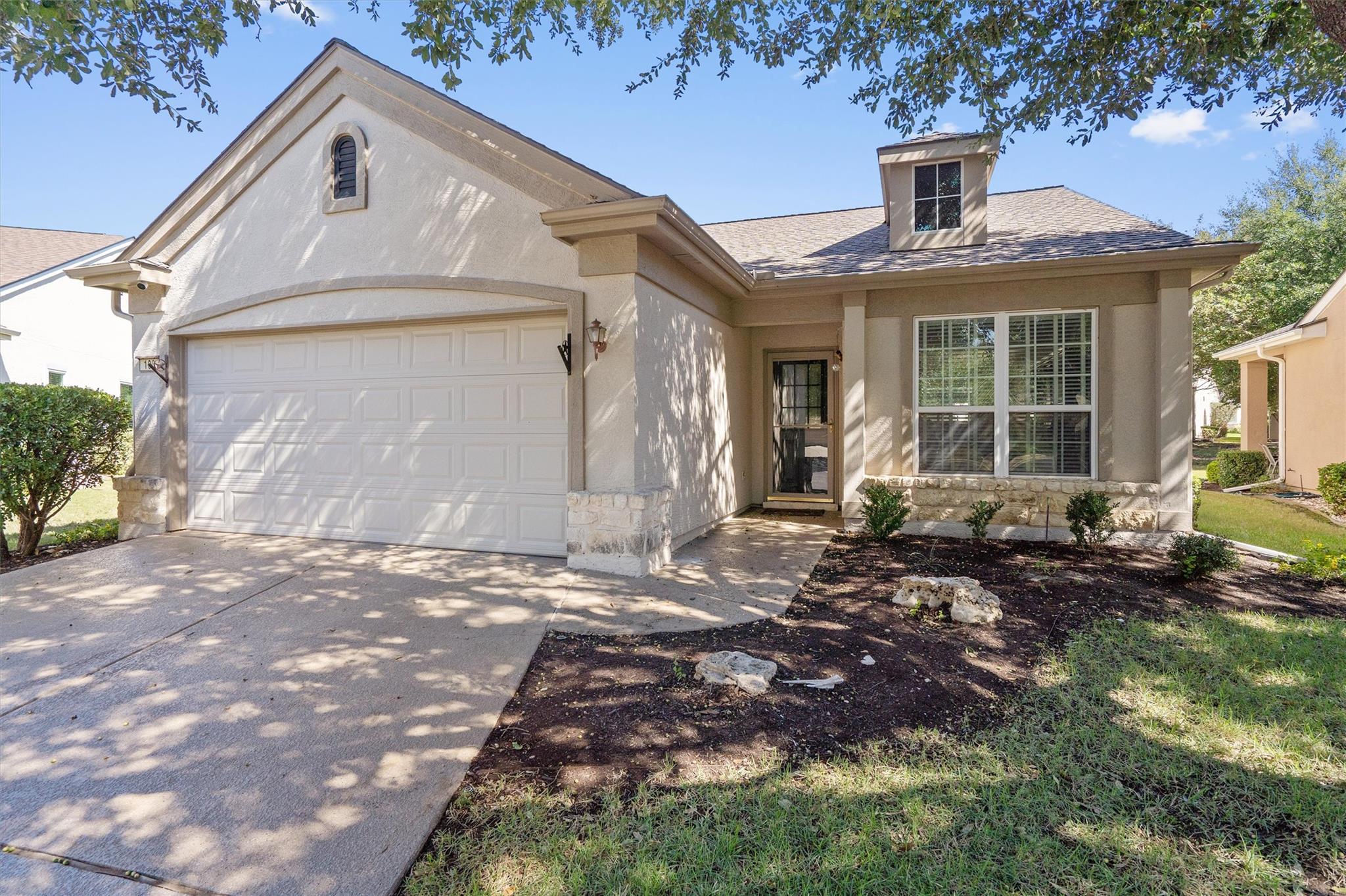 Charming stone accents and a classic gabled roofl