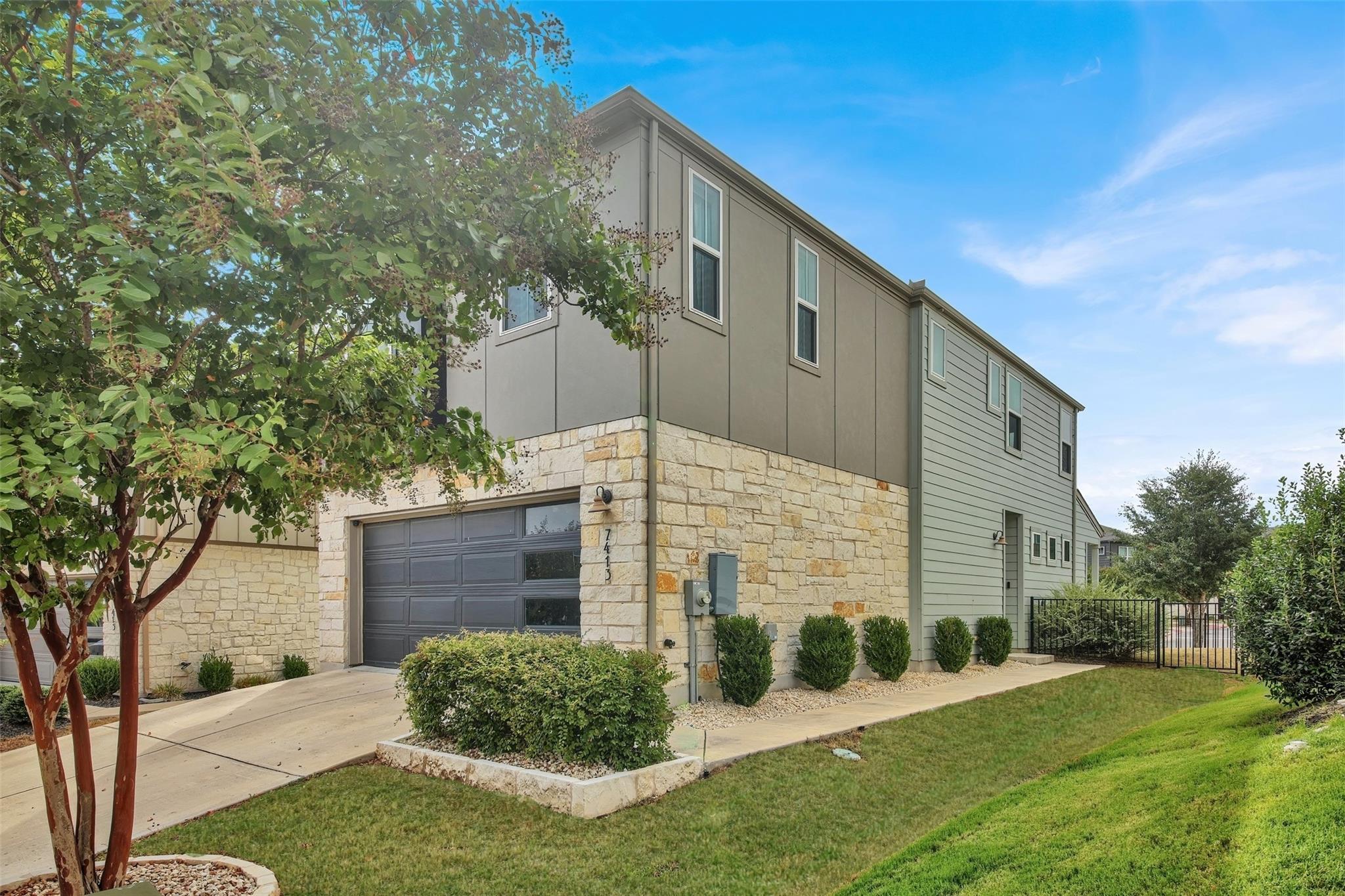 Natural stone and modern siding create timeless c