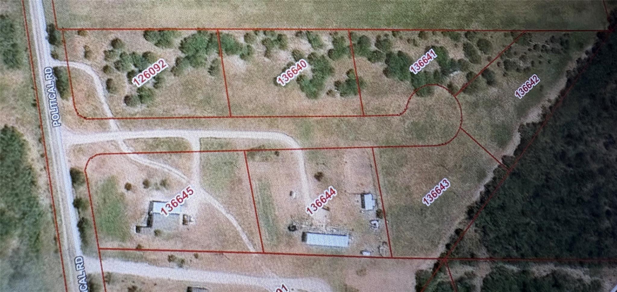 An aerial plat map outlines the parcel boundaries