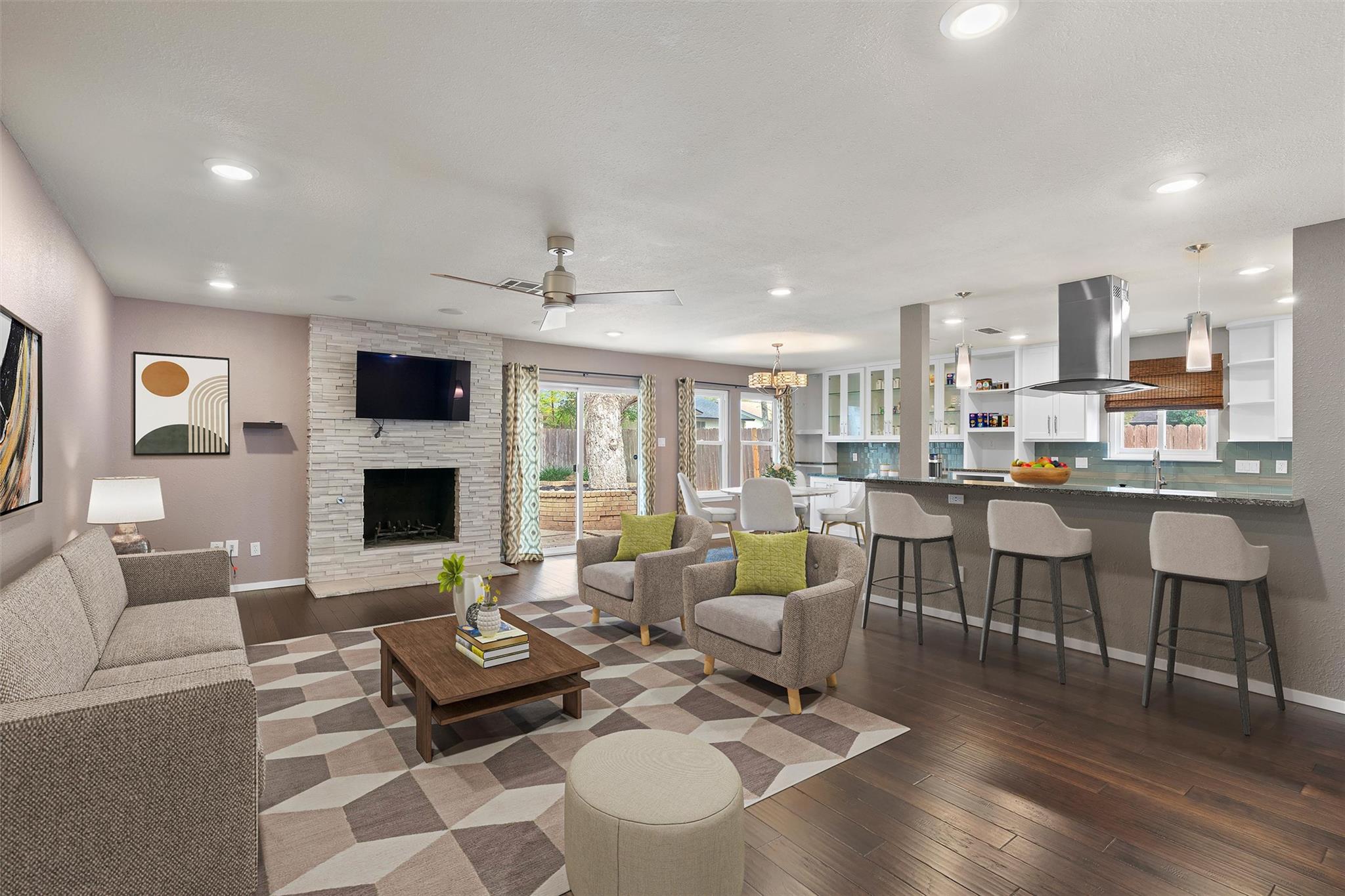 Rich hardwood flooring anchors an open-concept la