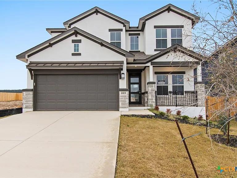 Crisp stucco and stone accents define this modern