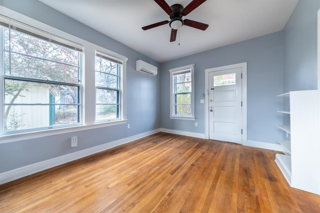 Rich hardwood flooring and abundant natural light