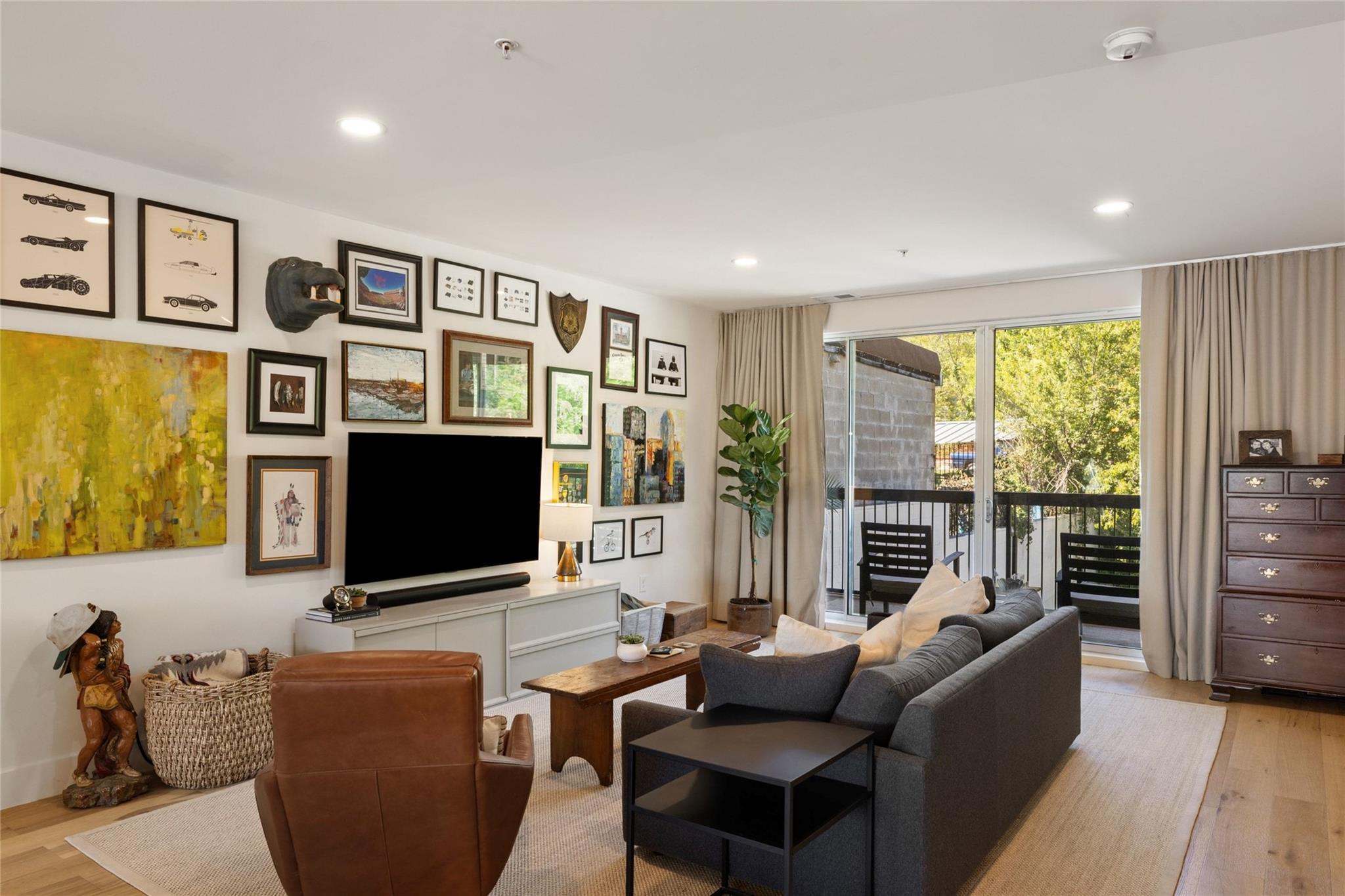 Large sliding glass doors open directly to a priv