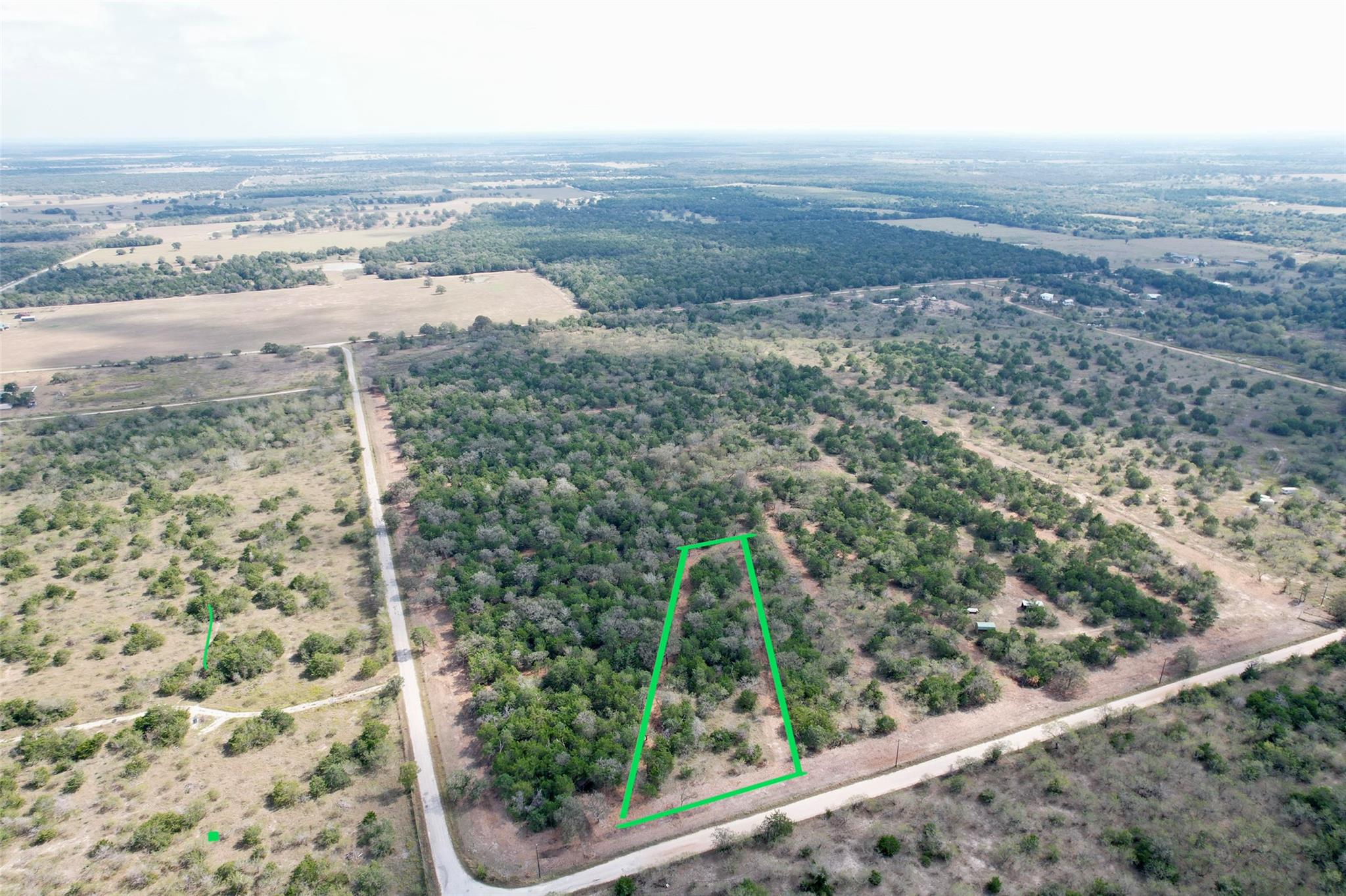 An aerial perspective showcases a sprawling, tree