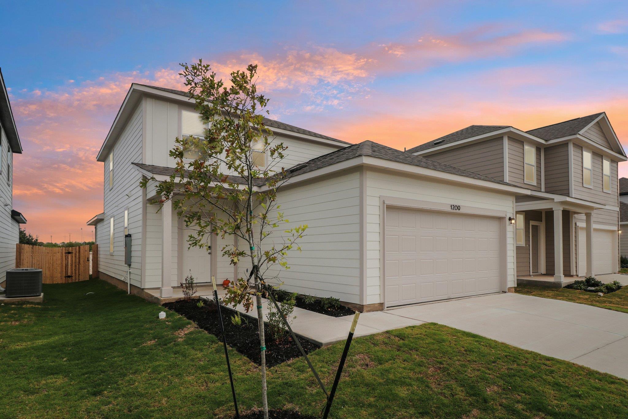 Clean lines and a two-car garage define this cont