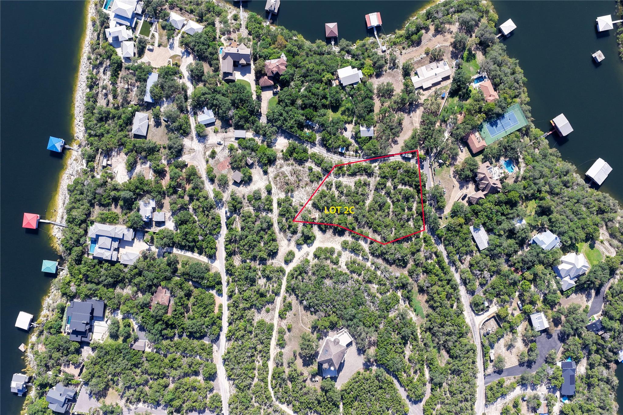 An aerial view highlights this wooded building si