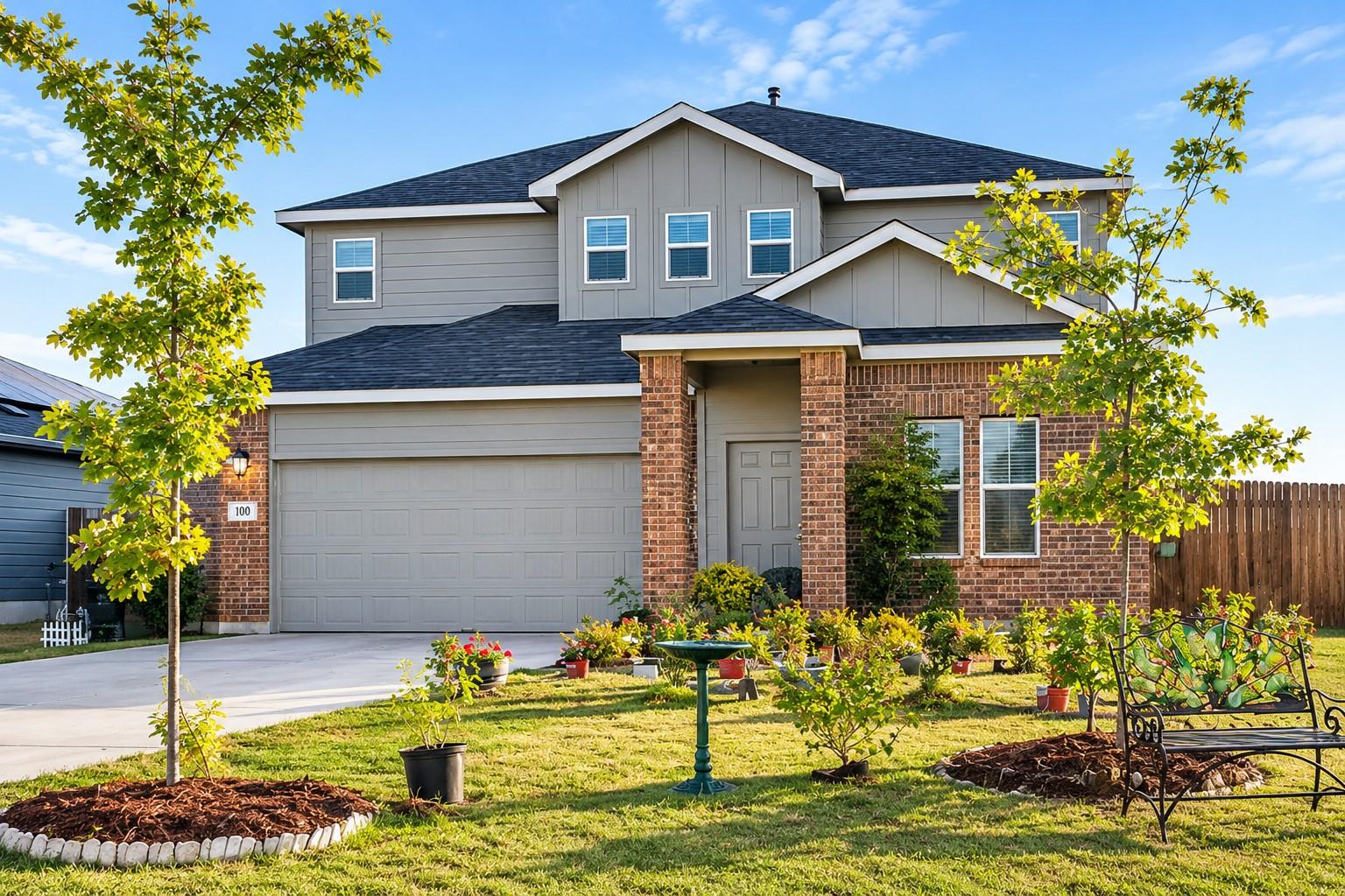 A classic brick and siding exterior stands behind