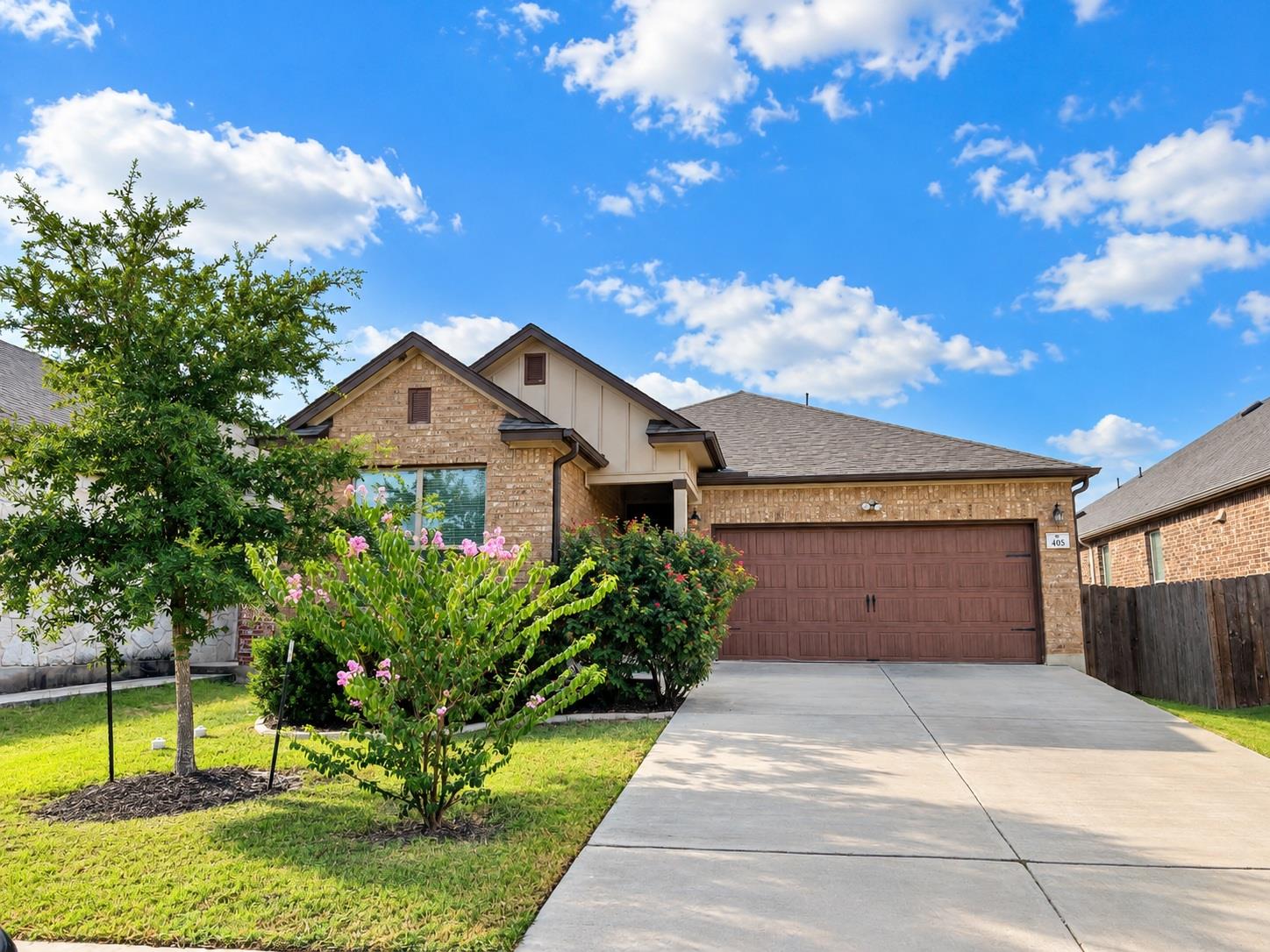 An inviting brick exterior paired with a spacious
