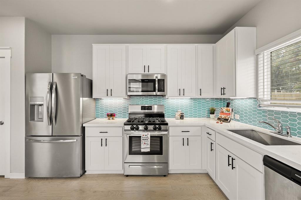 Clean white cabinetry and modern stainless steel 