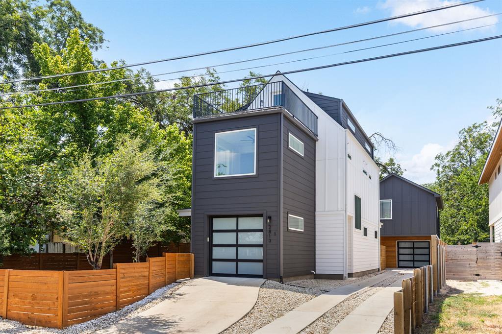 Modern multi-level architecture showcases a rooft