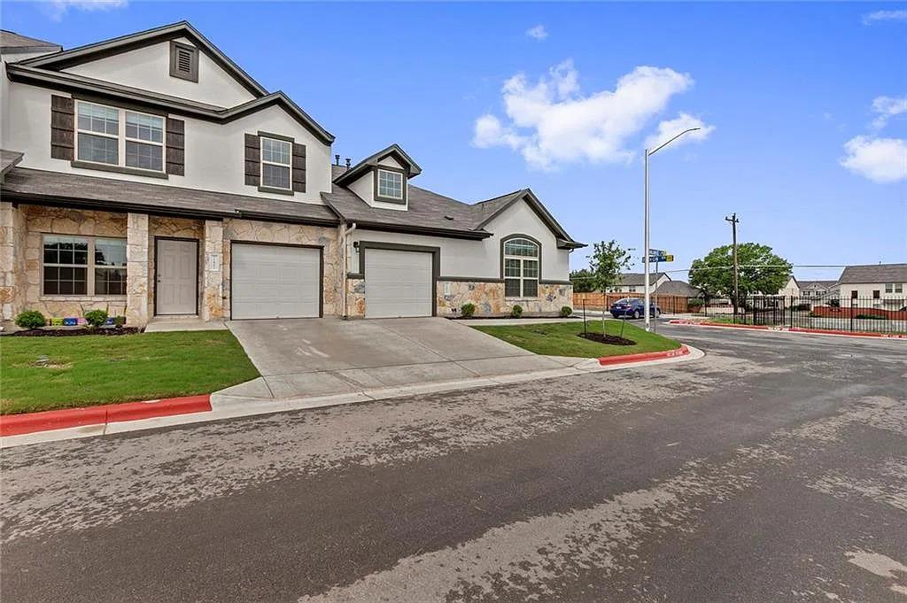 Attractive stone and stucco exteriors define this
