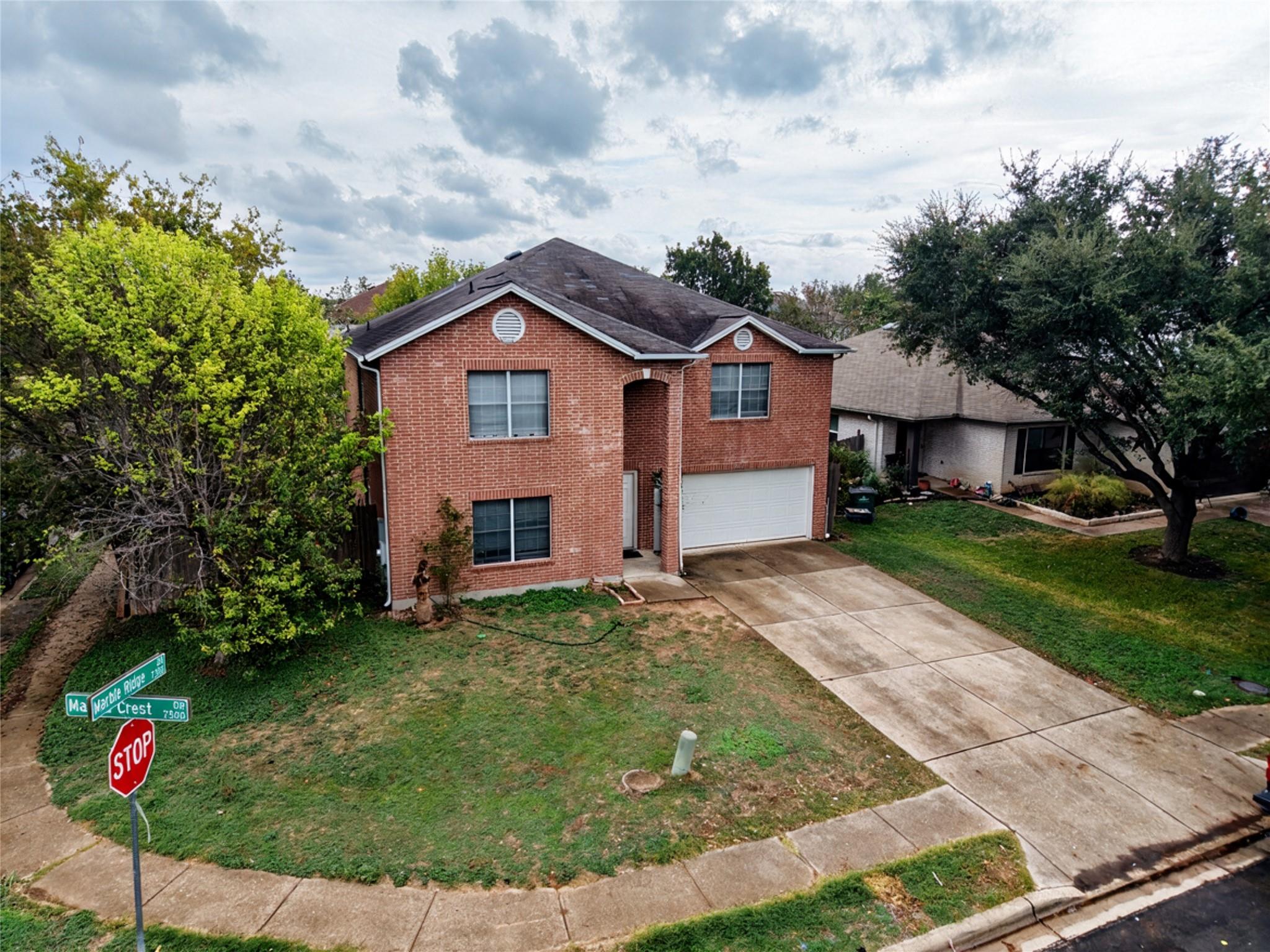 Classical brick architecture anchors this two-sto