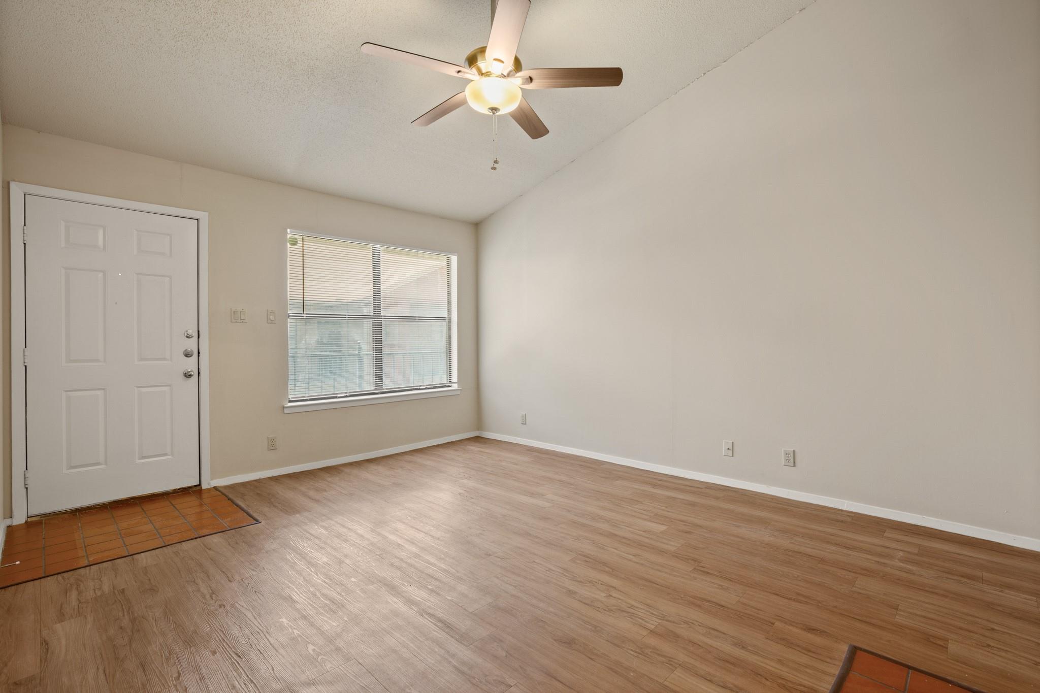 Vaulted ceilings elevate this versatile living sp
