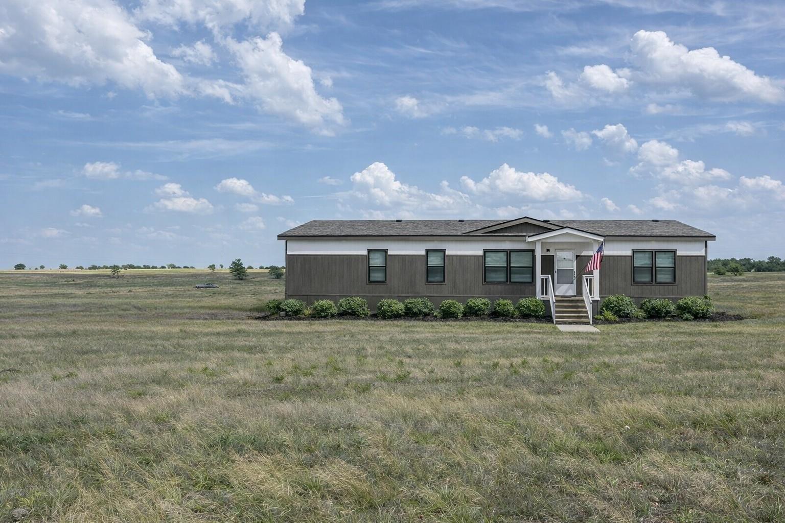 A classic one-story home sits among wide-open pla