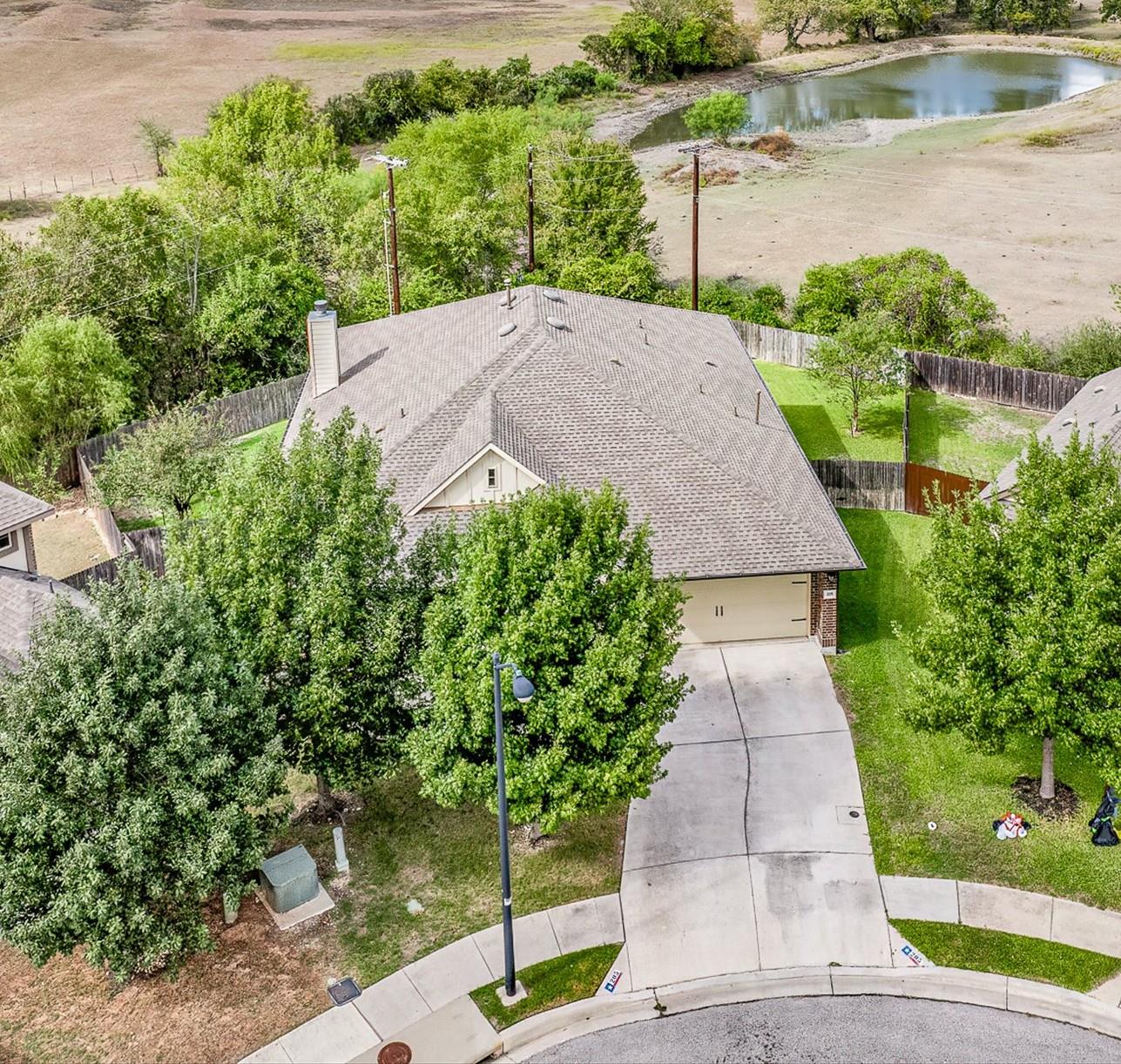 An aerial perspective showcases a shingled roofli