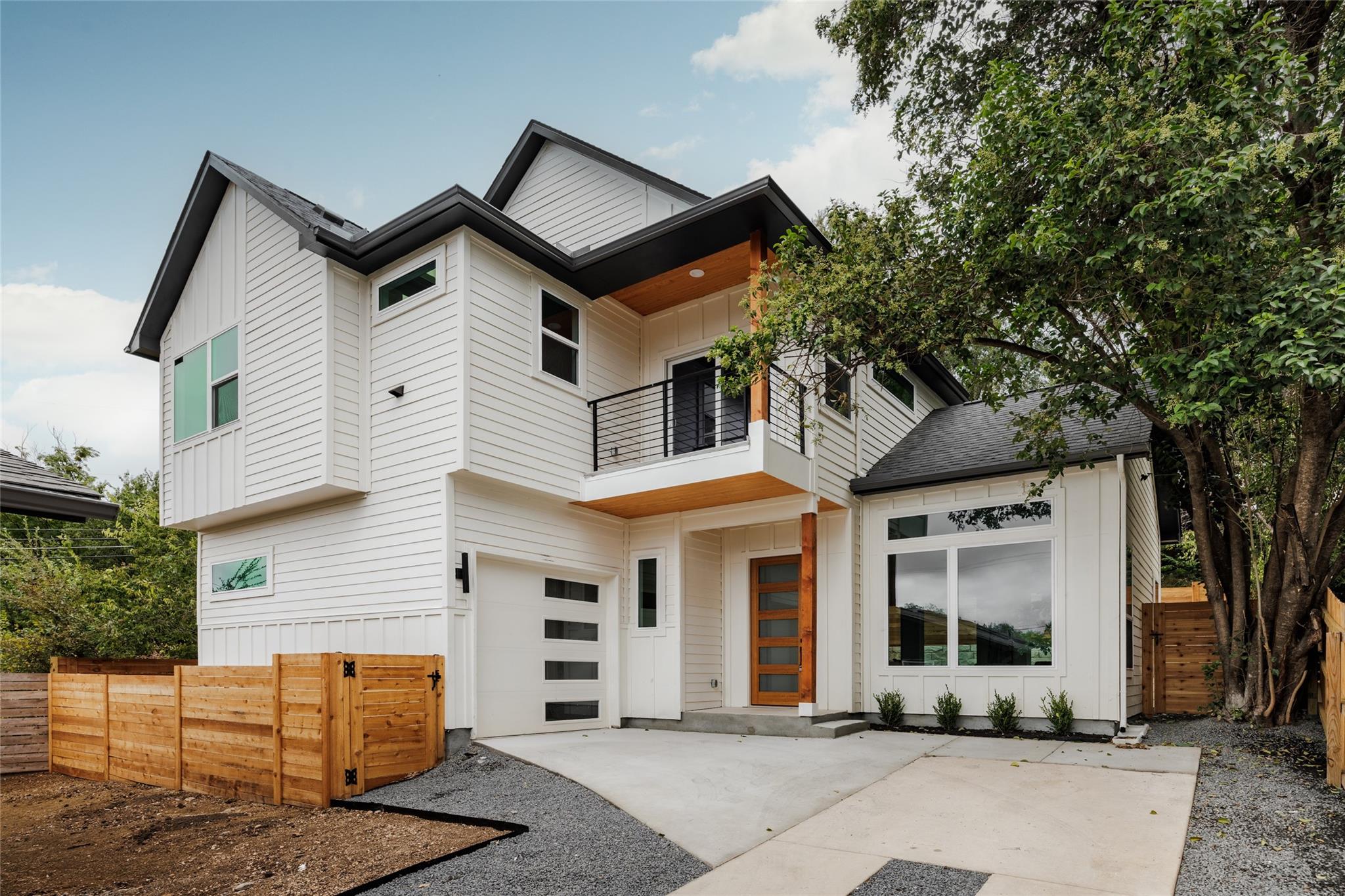 Crisp white siding paired with warm wood details 