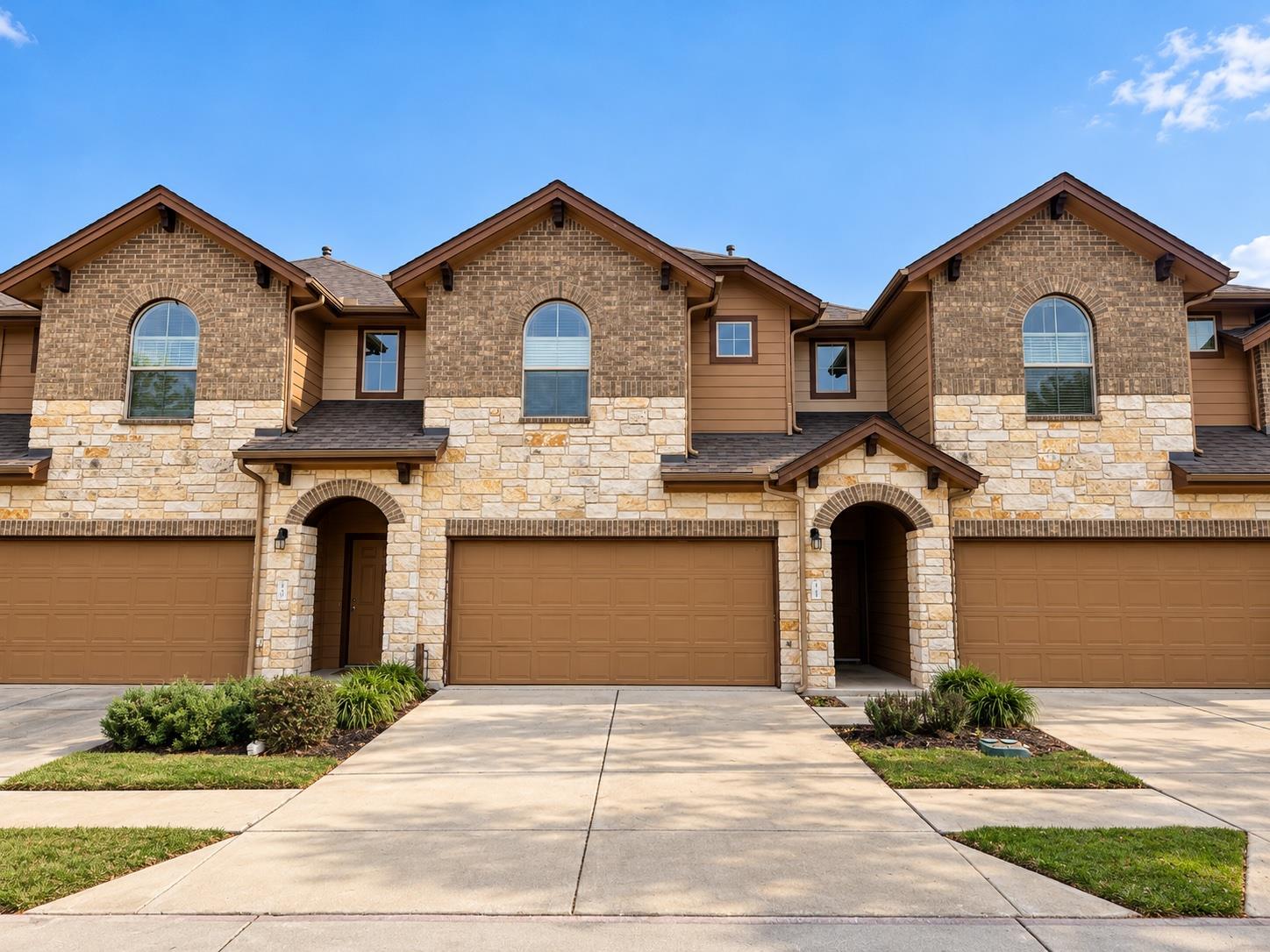 Striking stone and brick accents define the exter