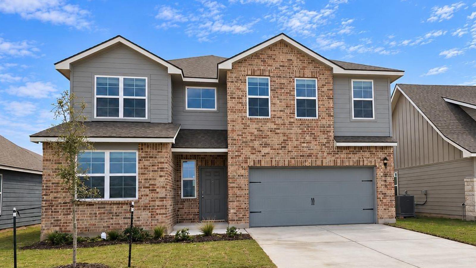 Multi-textured siding and brick masonry establish