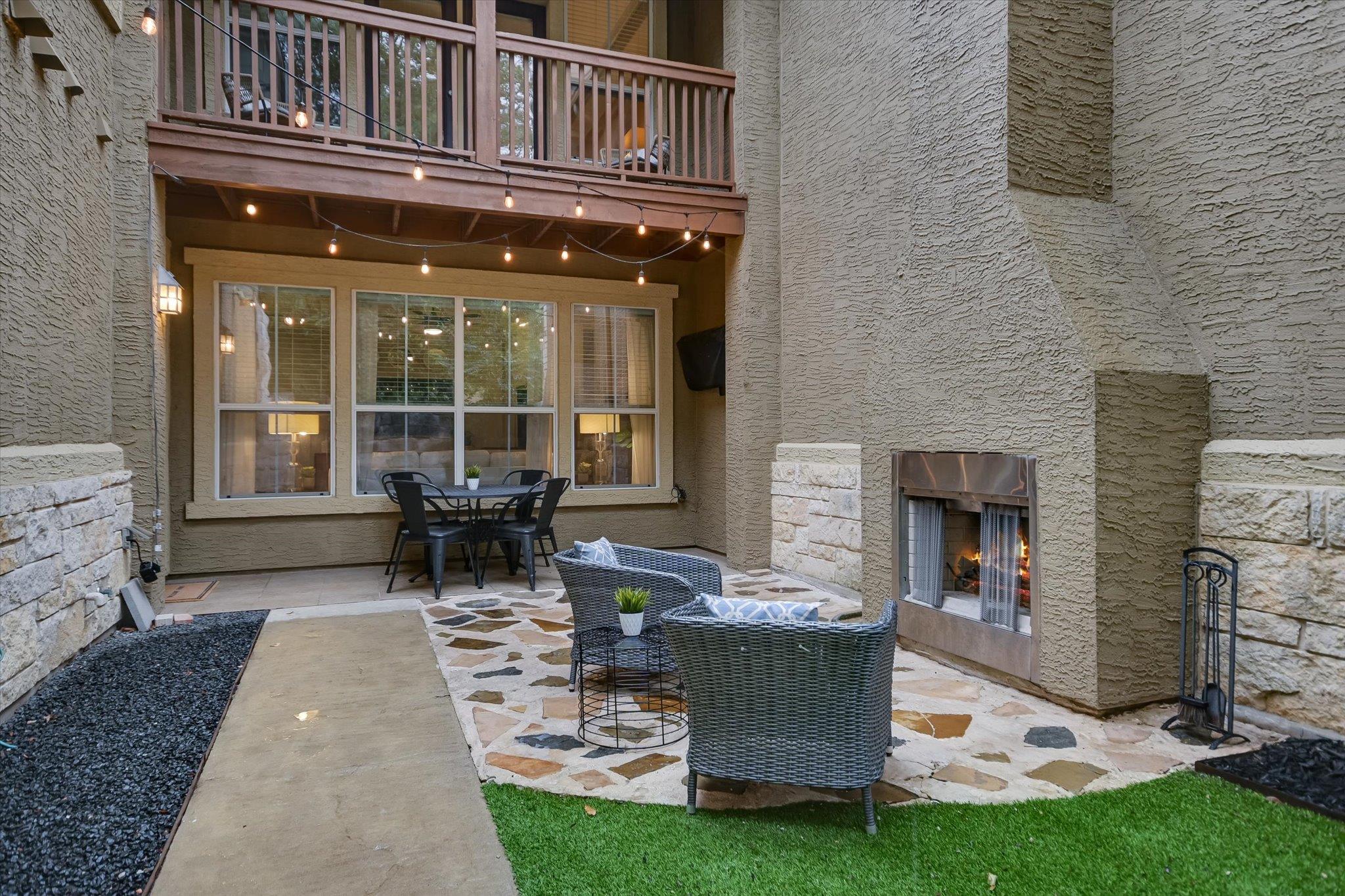 An inviting stone-paved courtyard is anchored by 